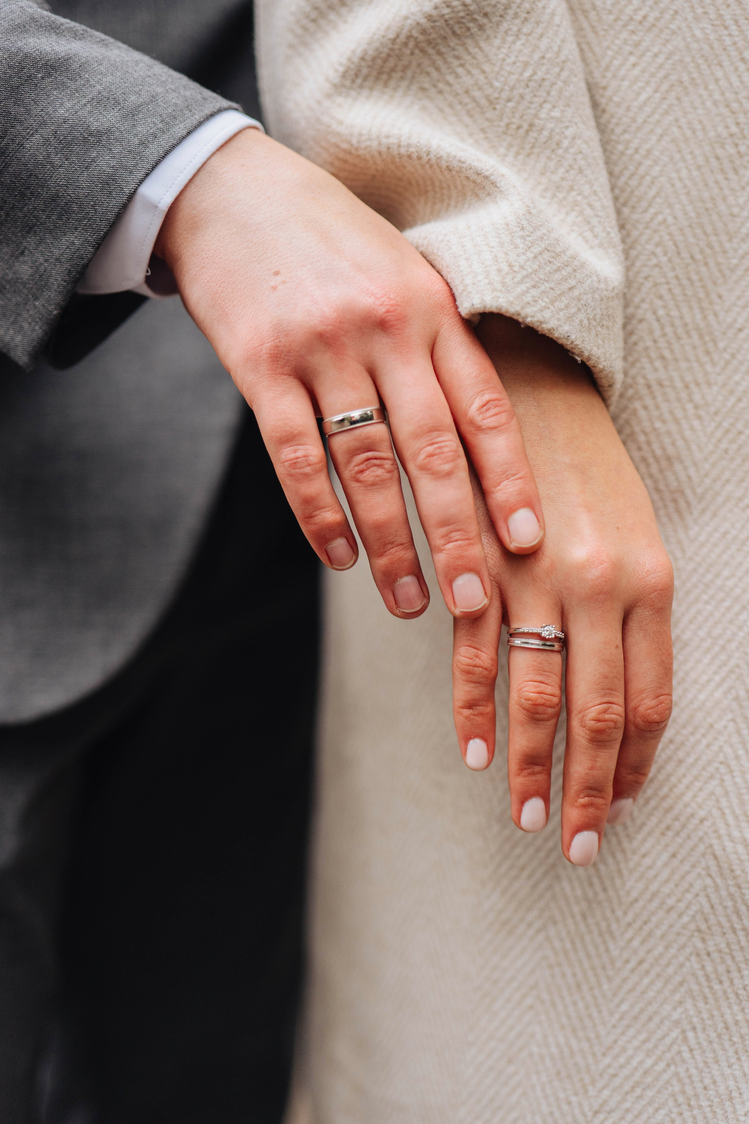 stylish closeup photo of hands with wedding rings