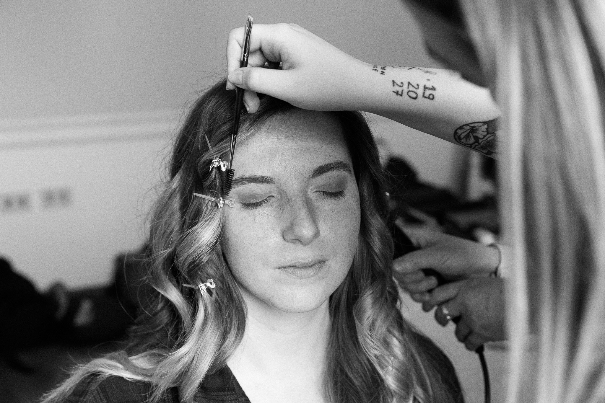 A woman getting ready at Hotel Lancelot, makeup artist.