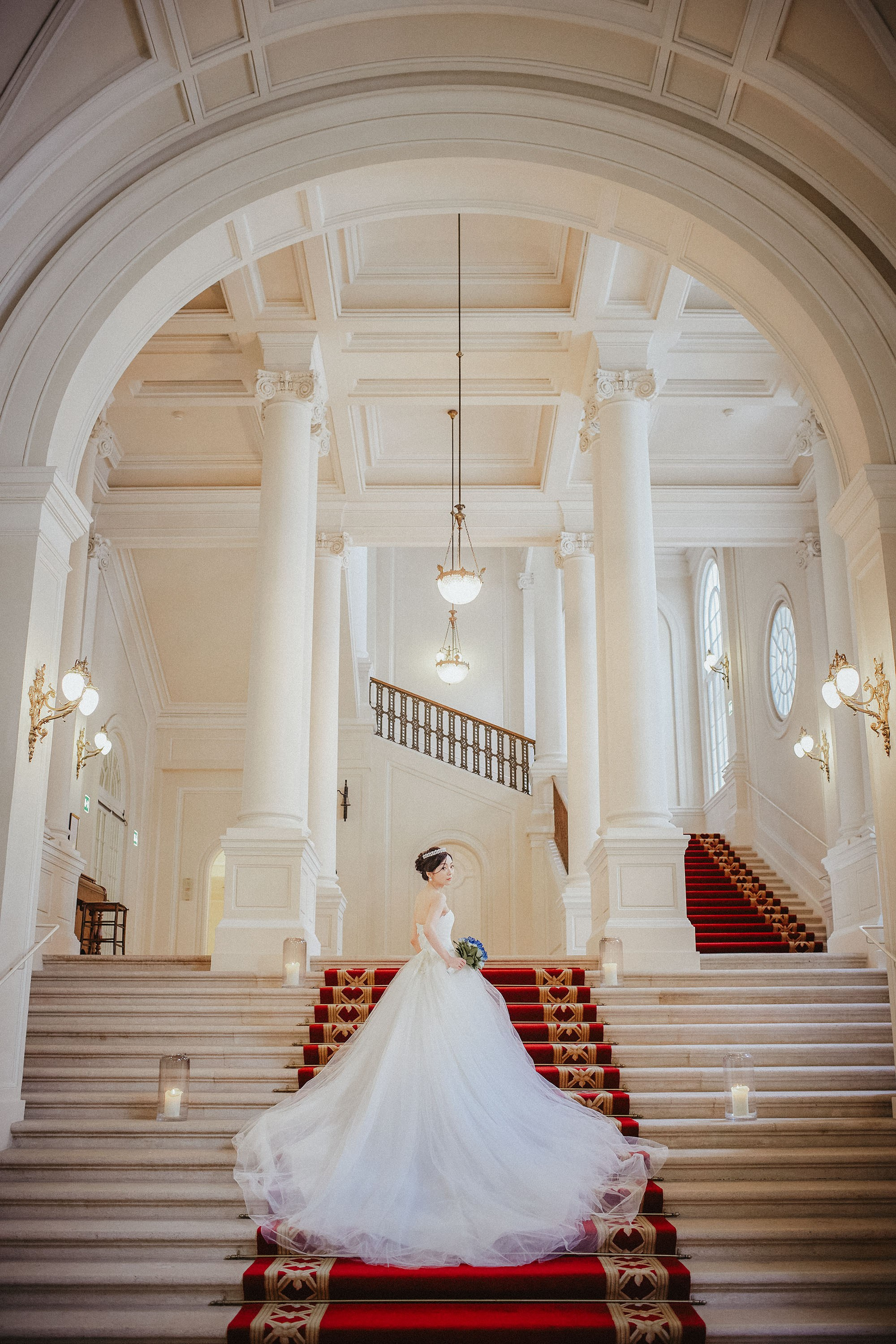 A stunning portrait of the bride in the interior of the Palais Coburg.