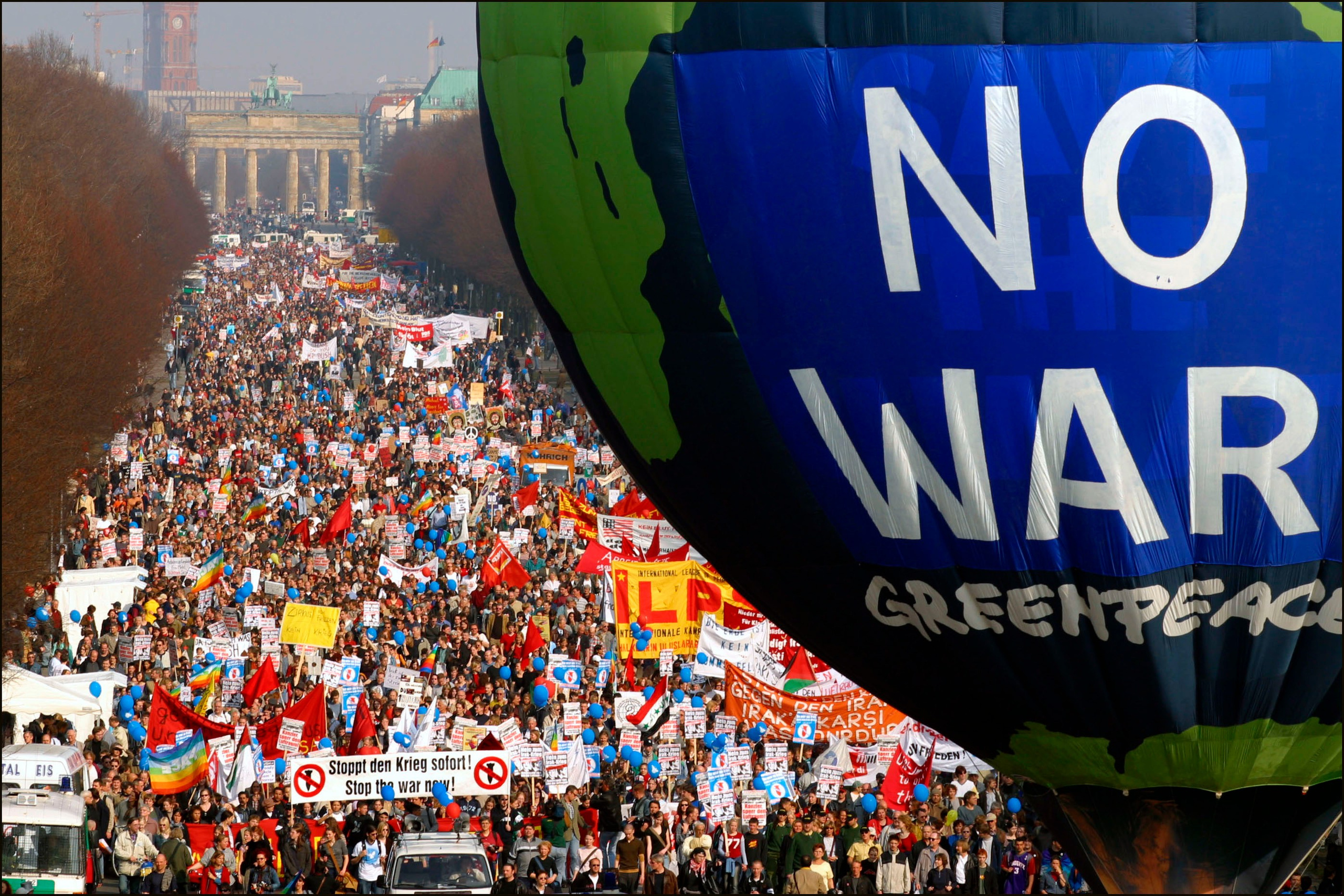 Anti-war protesters march from the Brandenburg Gate to the Victory Column March 29, 2003 in Berlin, Germany. Over 50,000 people took to the streets in Berlin in a peaceful protest against the U.S.-led war in Iraq. (Photo by Kurt Vinion/Getty Images)