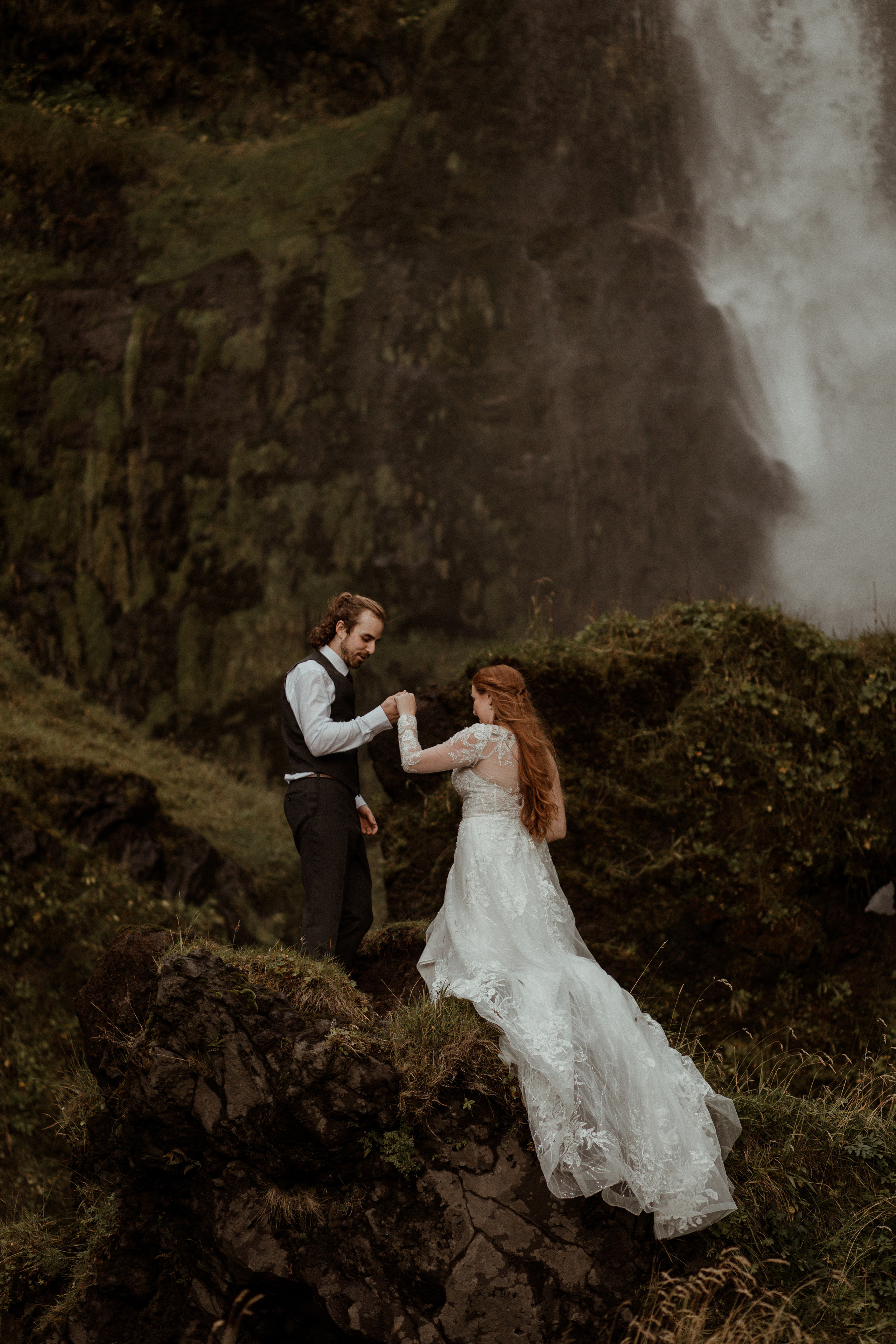 Ceremony at secret waterfall Iceland. Iceland elopement photographer & videographer
