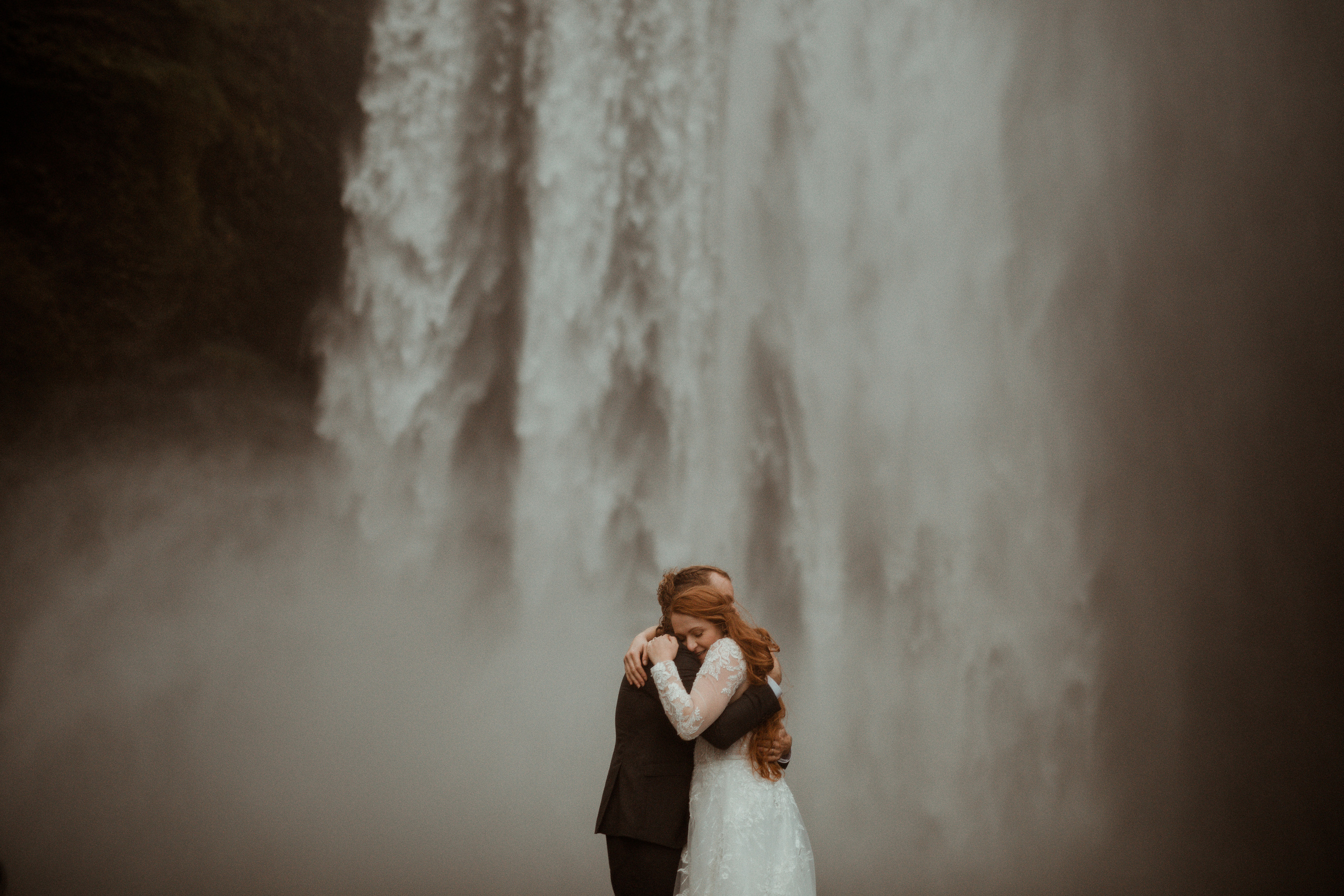 Ceremony at secret waterfall Iceland. Iceland elopement photographer & videographer