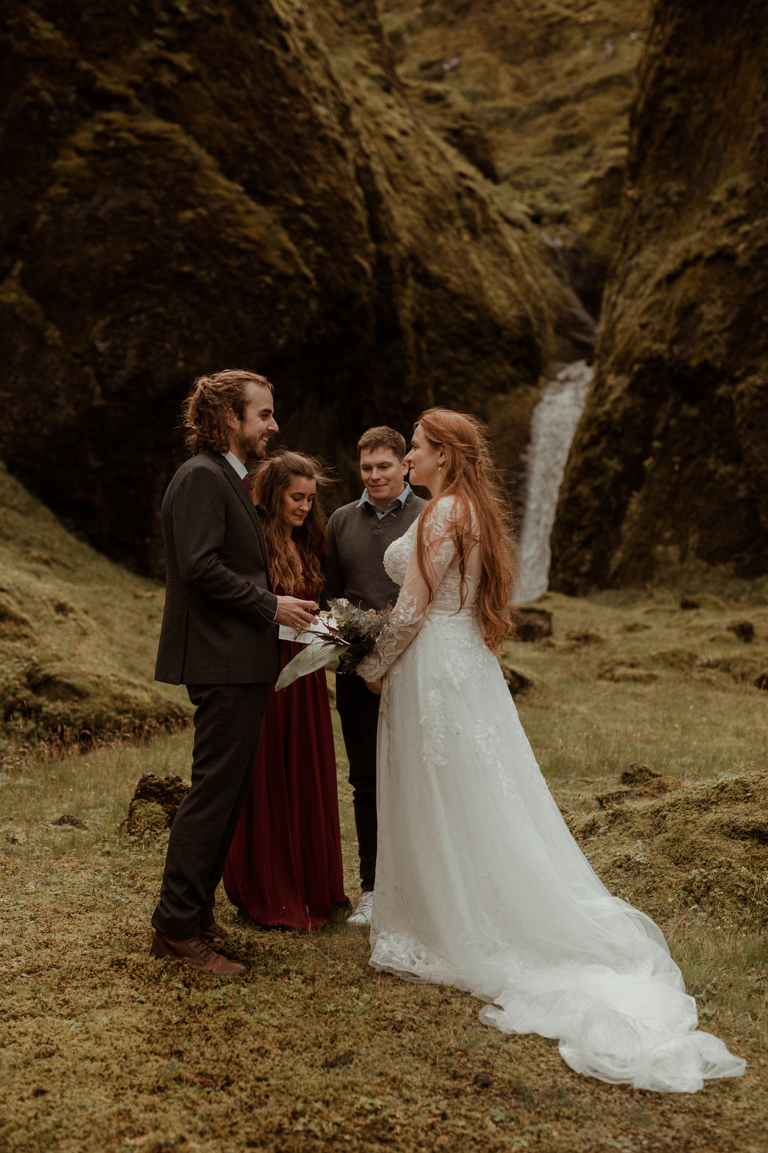 Ceremony at secret waterfall Iceland. Iceland elopement photographer & videographer
