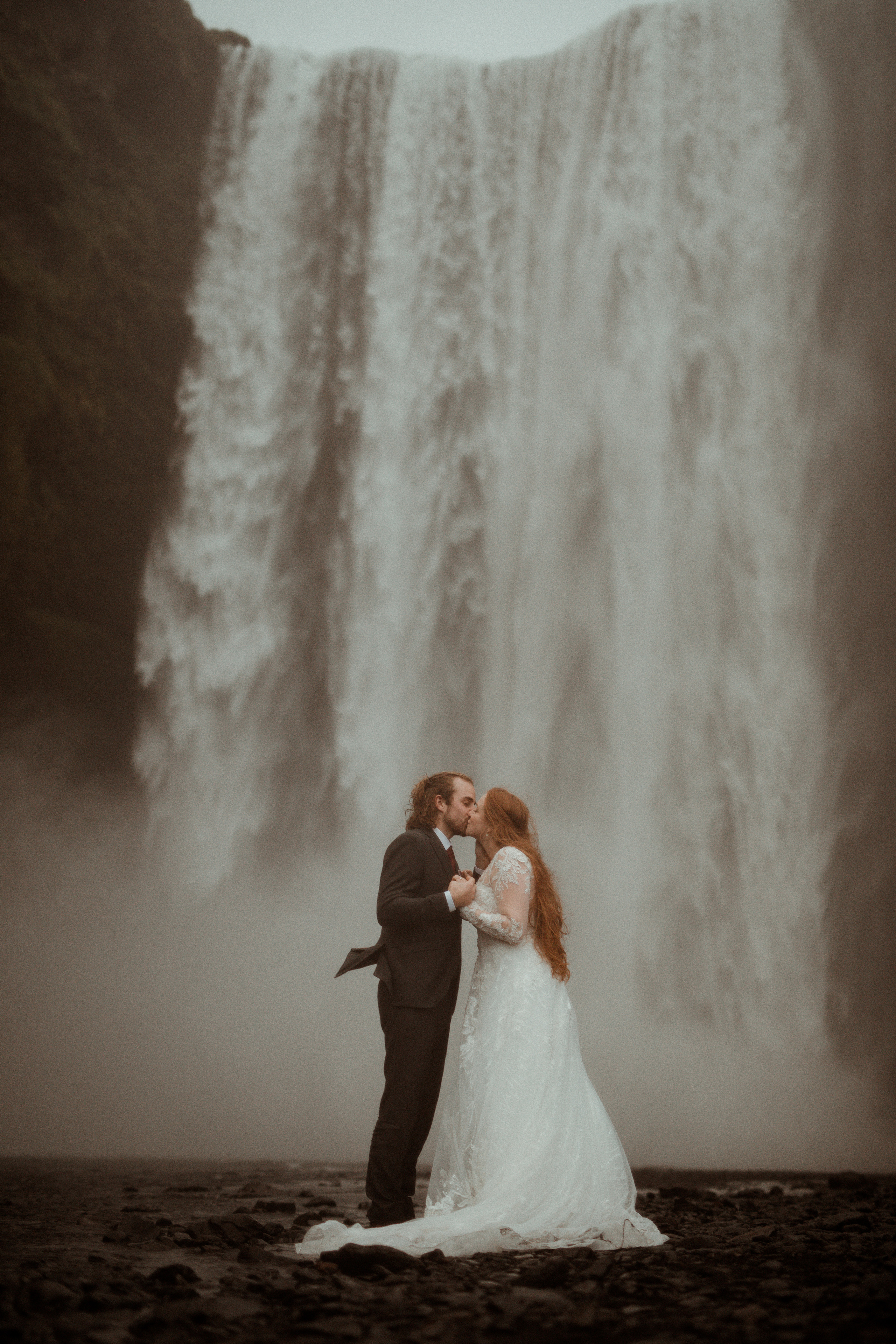 Ceremony at secret waterfall Iceland. Iceland elopement photographer & videographer