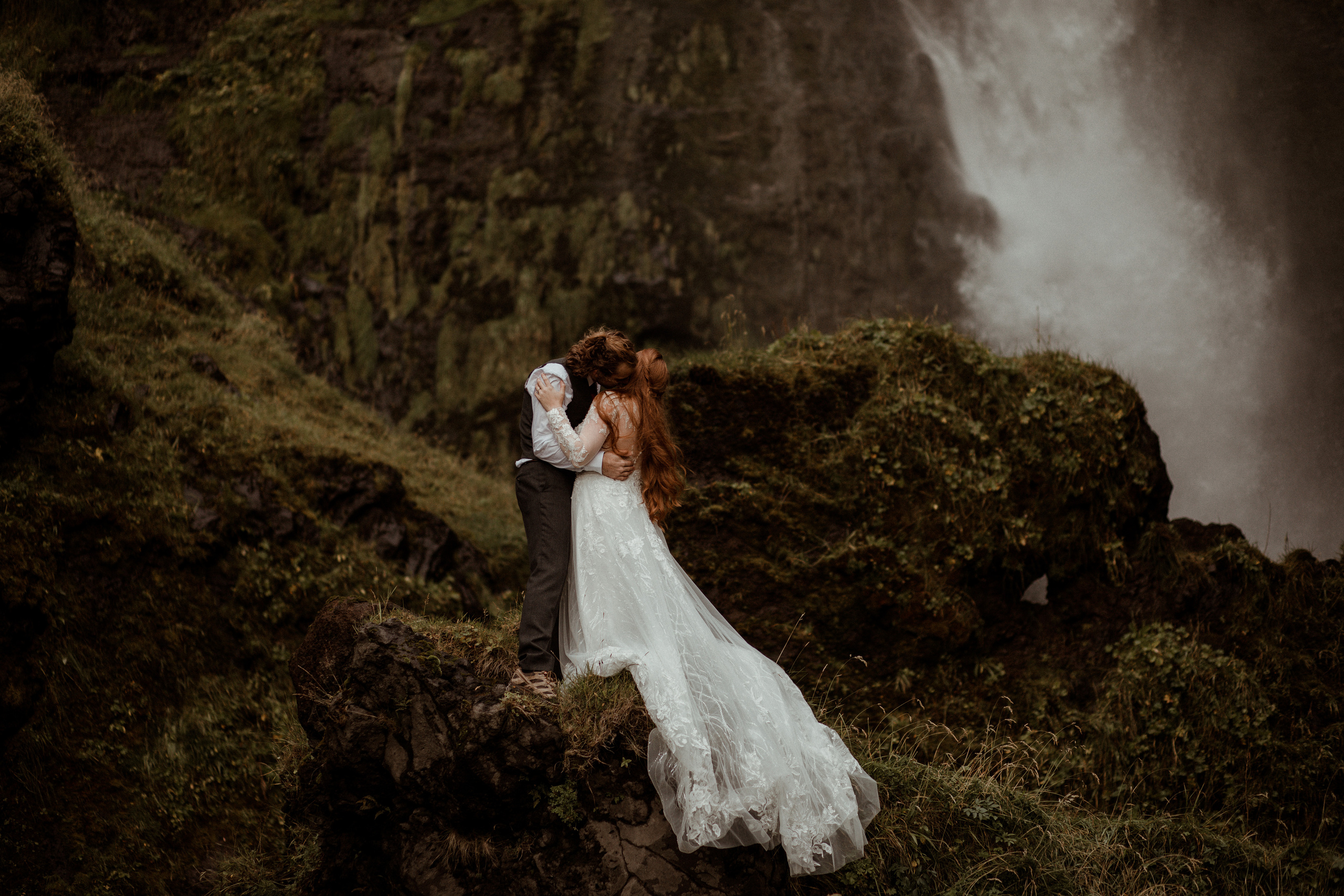 Ceremony at secret waterfall Iceland. Iceland elopement photographer & videographer