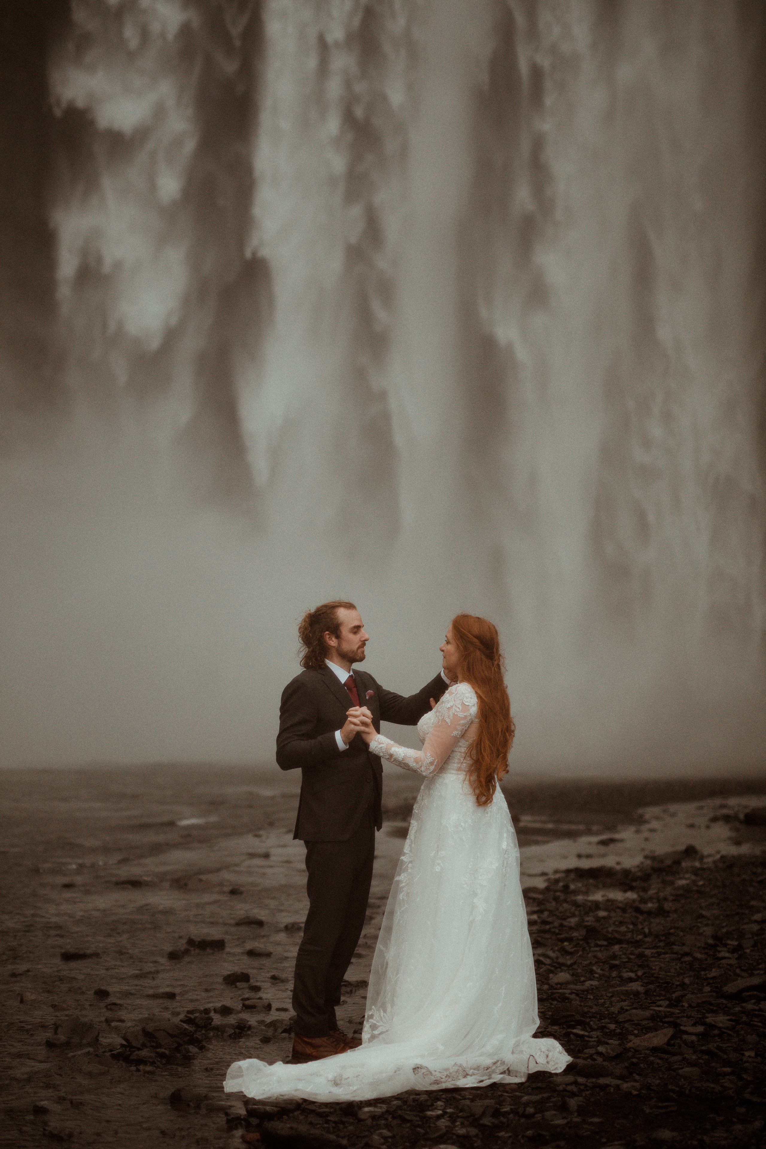 Ceremony at secret waterfall Iceland. Iceland elopement photographer & videographer