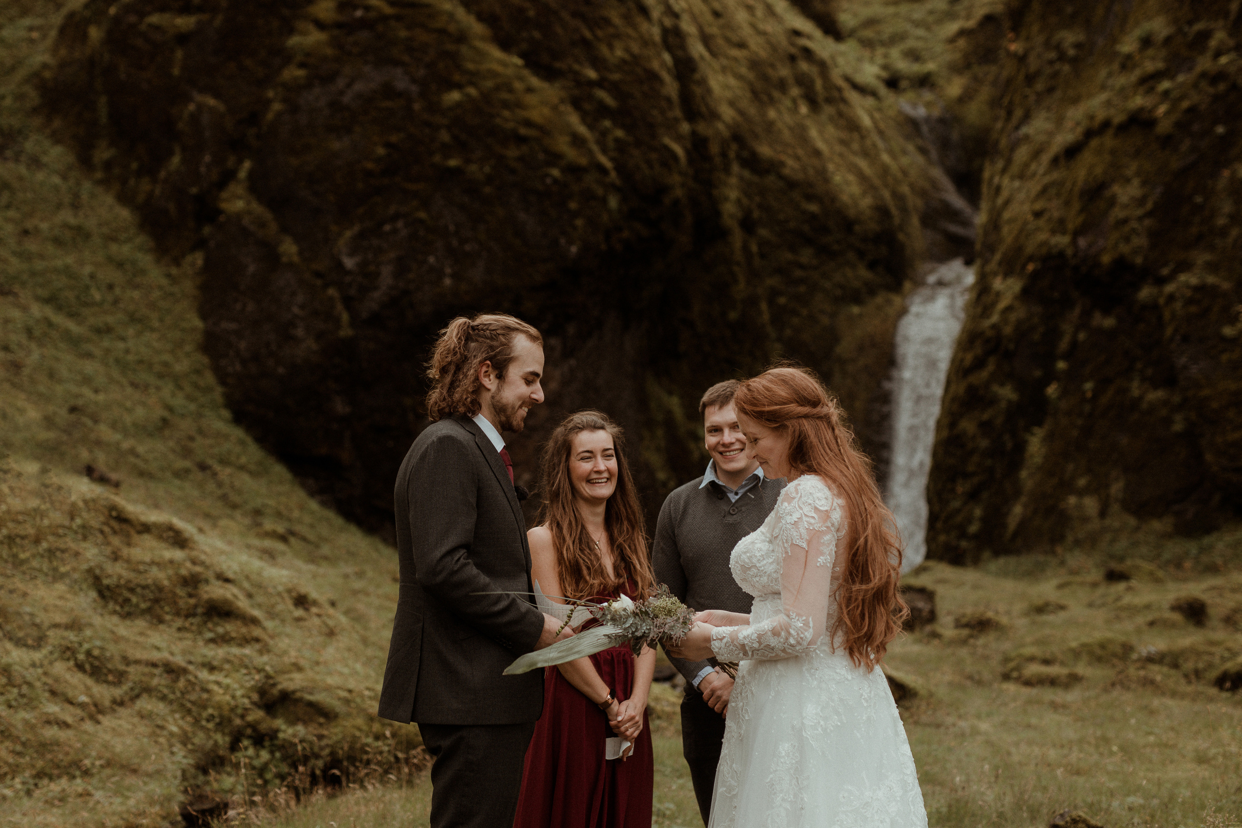 Ceremony at secret waterfall Iceland. Iceland elopement photographer & videographer