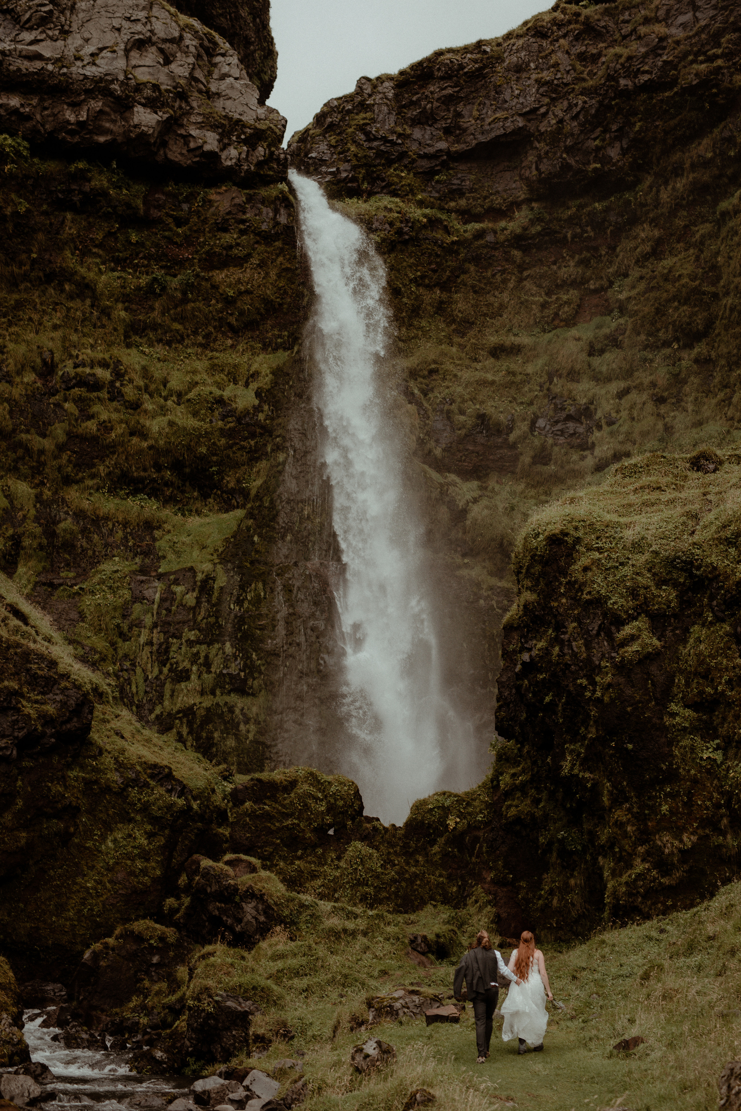 Ceremony at secret waterfall Iceland. Iceland elopement photographer & videographer