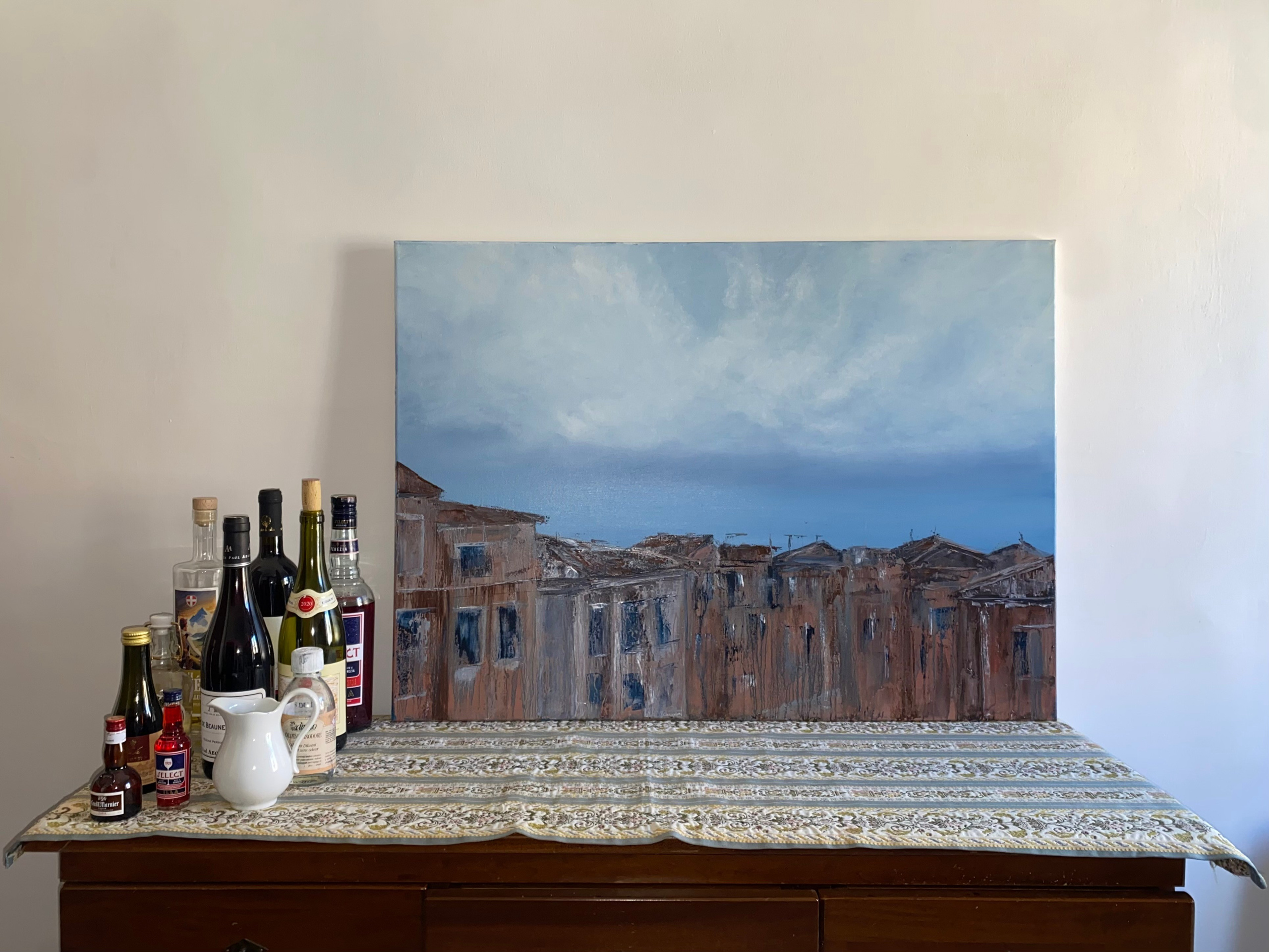 A stormy sky over a melting Venezia town in soft pink and grey undertones by Ekaterina Solopova