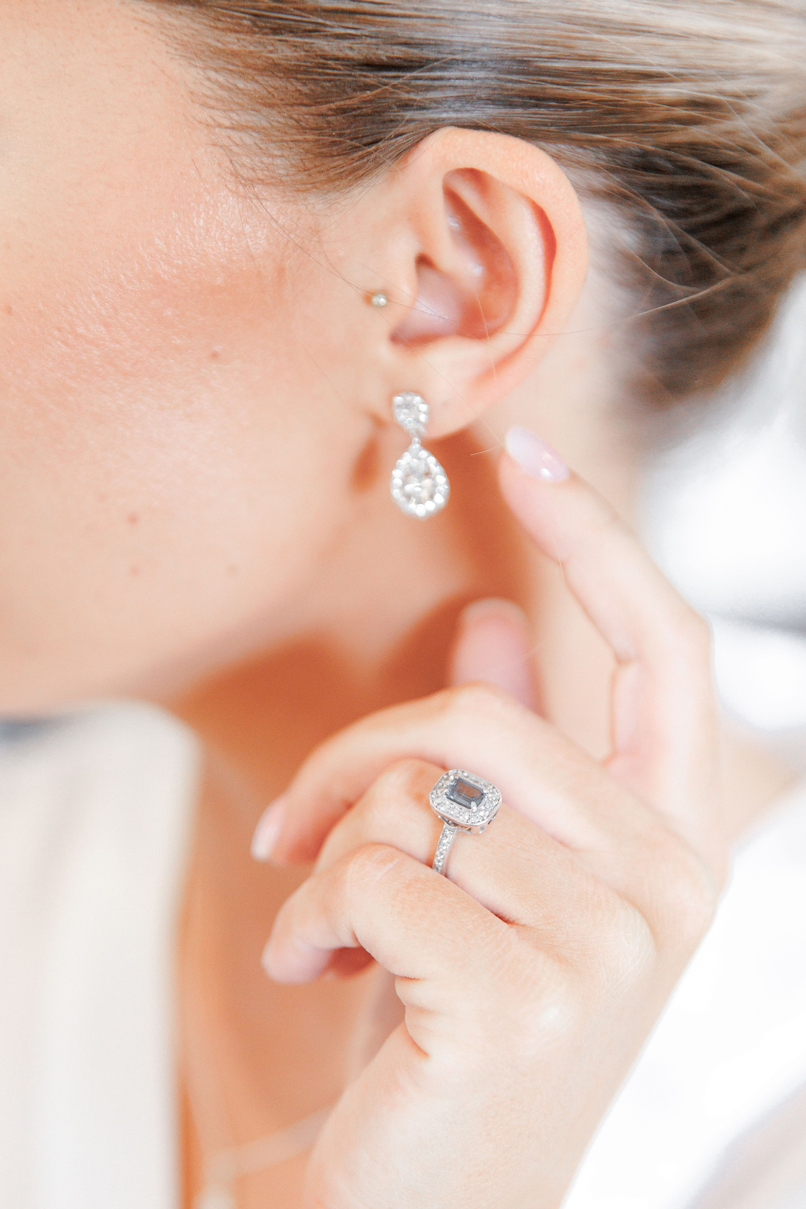 Glamorous bridal shot highlighting the engaging ring and jewelry for a destination wedding in Barcelona.