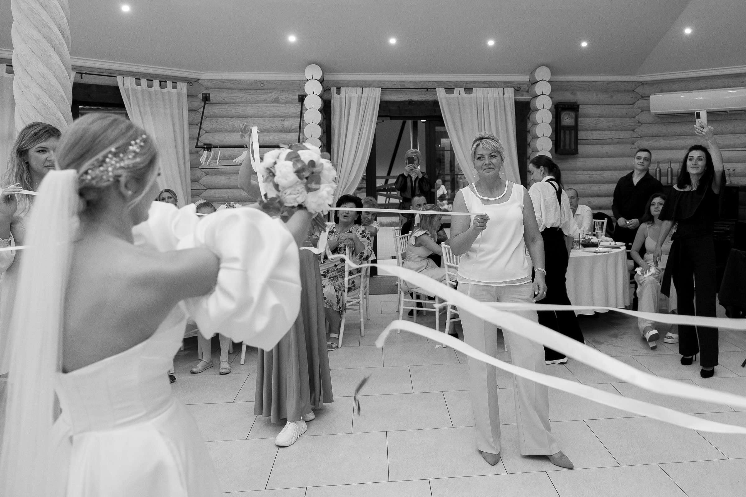 Bride bouquet toss, by Cornwall wedding photographer.