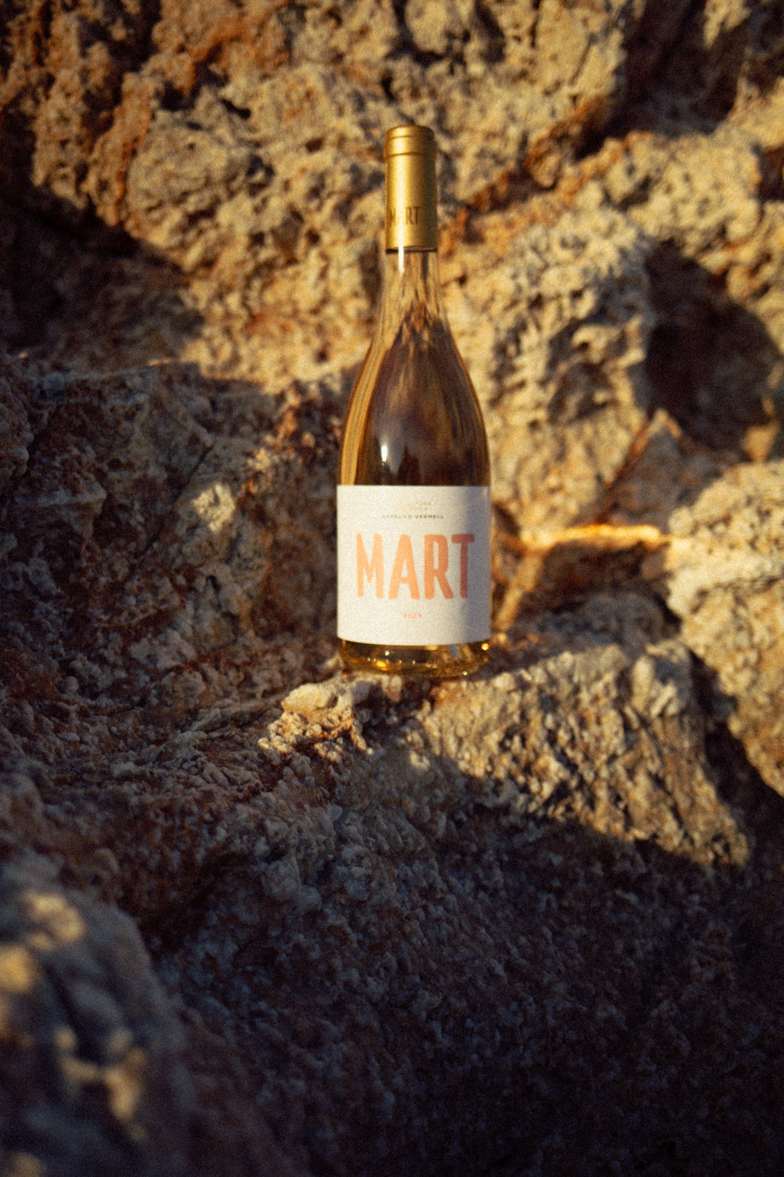 Wine bottle styled with surreal, Mars-like tones — Gramona Mart