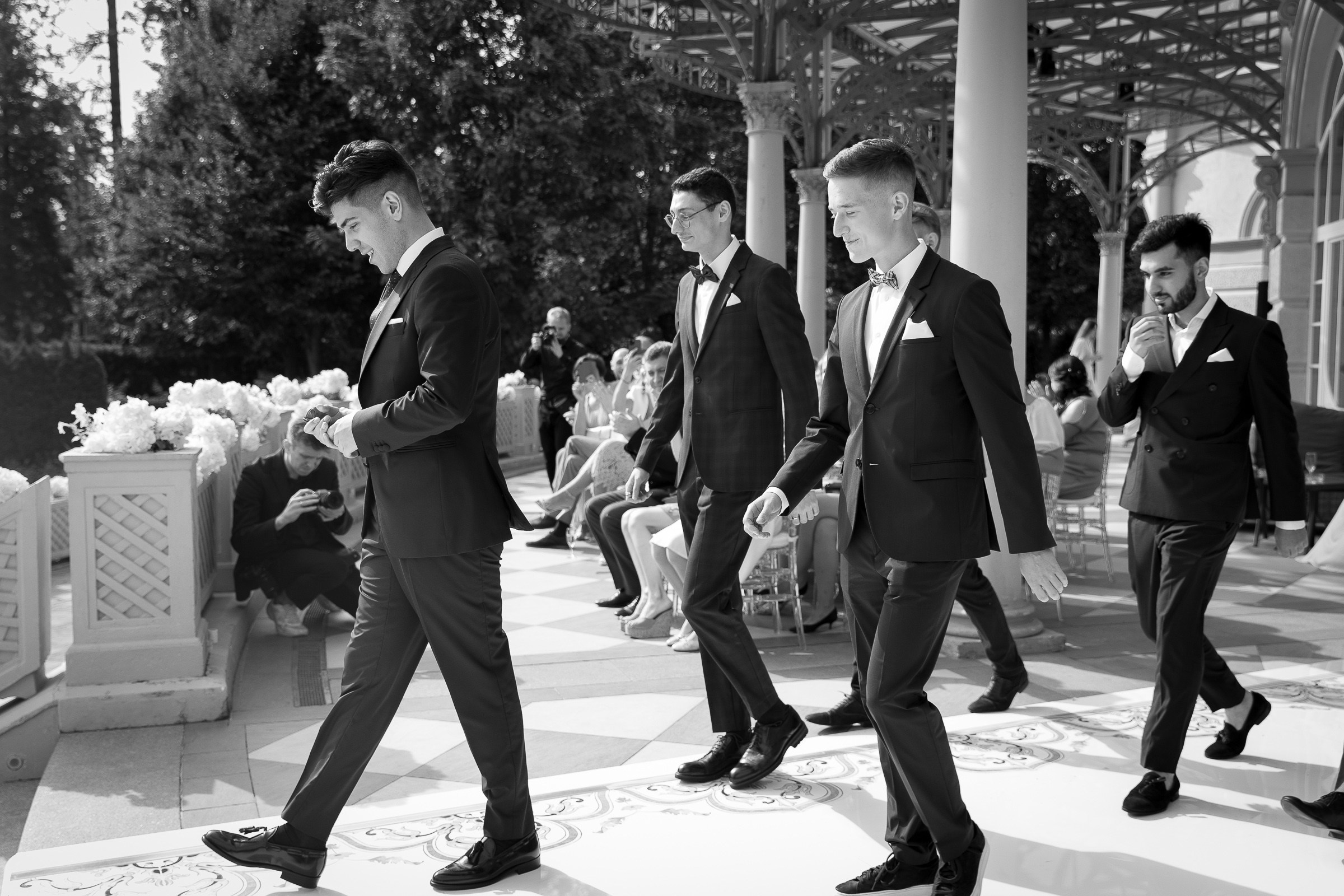 Groom with groomsmen walking down aisle, by Bude, Cornwall wedding photographer.