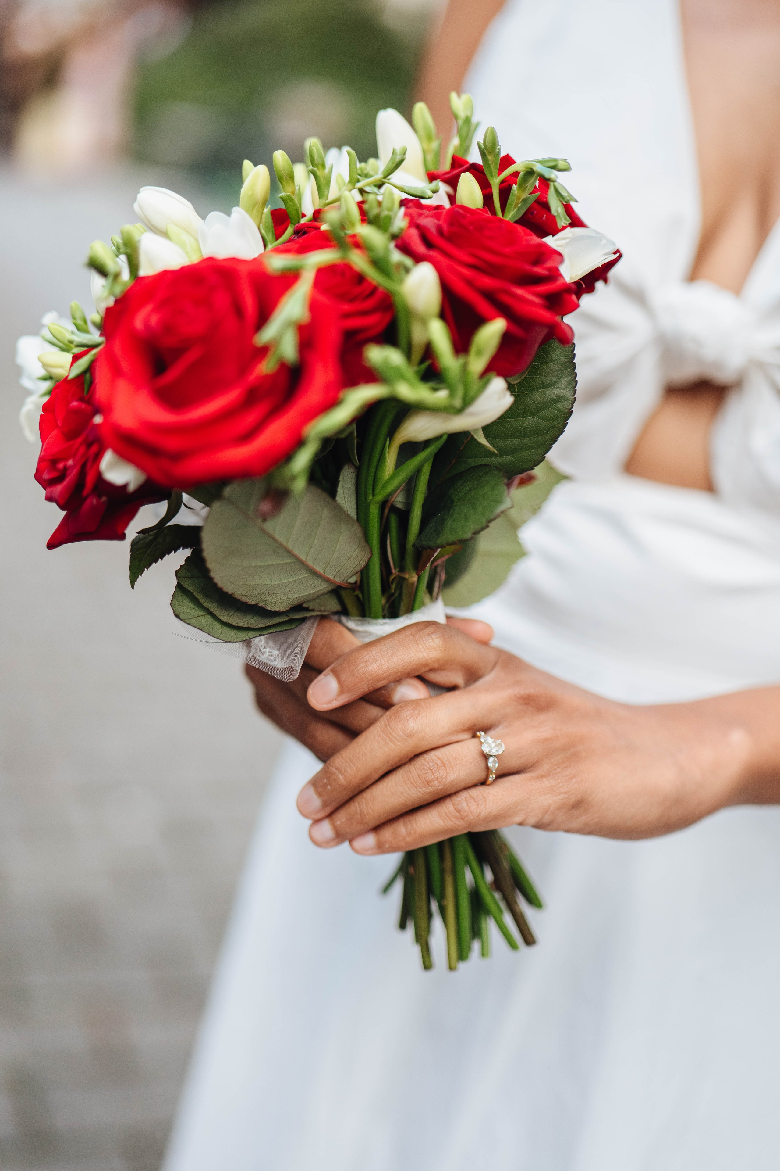 Wedding photography in london, bride close up, red flowers