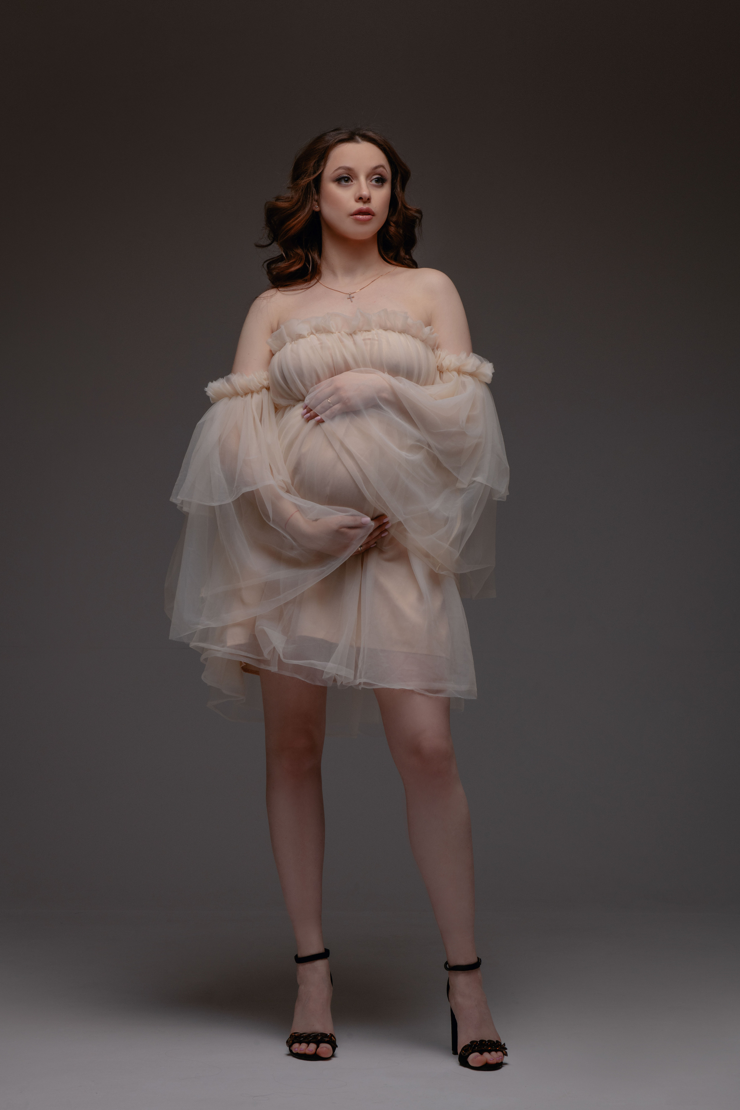 Pregnancy photoshoot in the studio in Prague and Czech Republic. Professional photographer in Prague Anastasia Haritonova