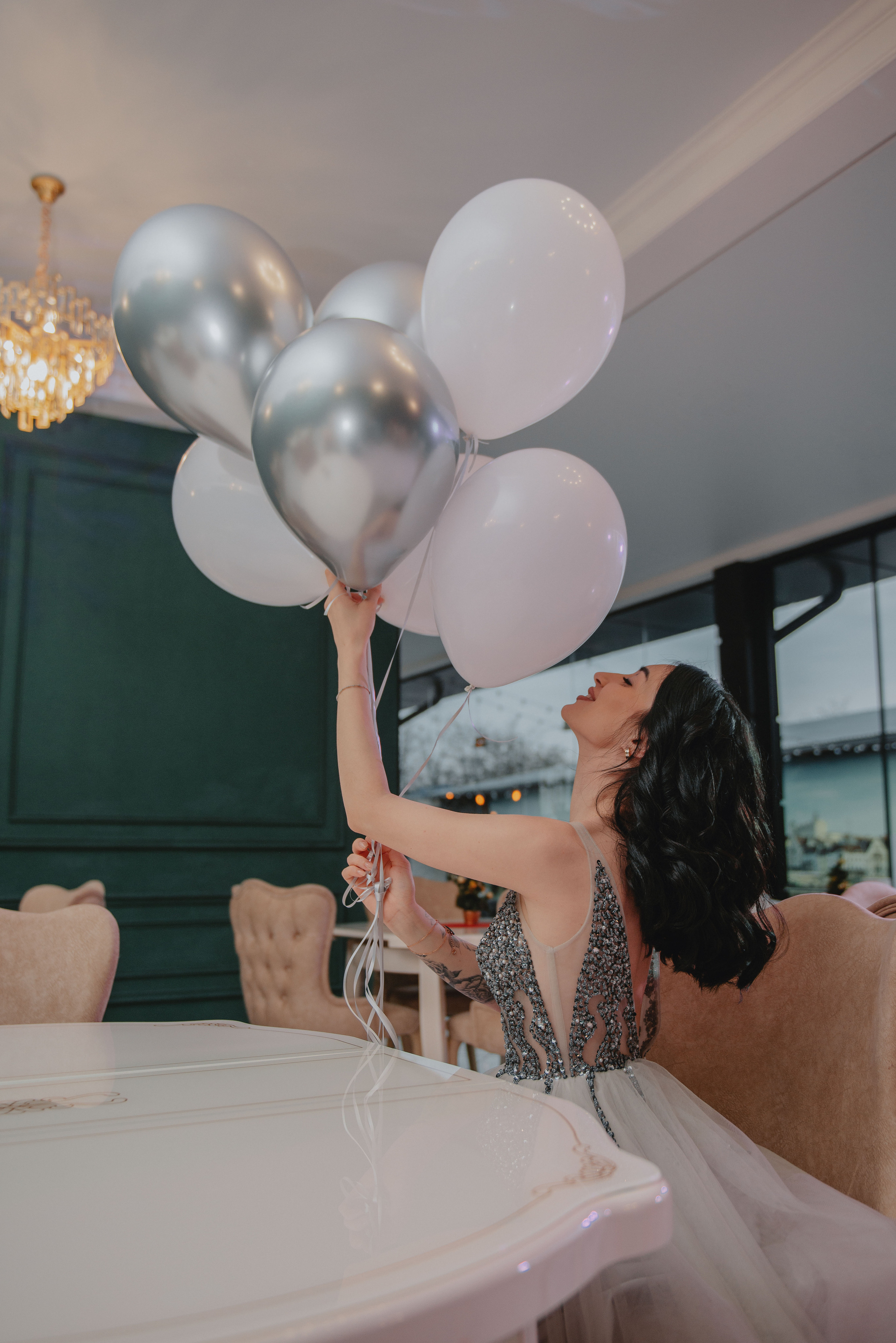 Portrait photoshoot in beautiful dresses in a restaurant in Prague. Professional photographer in Prague Anastasia Haritonova