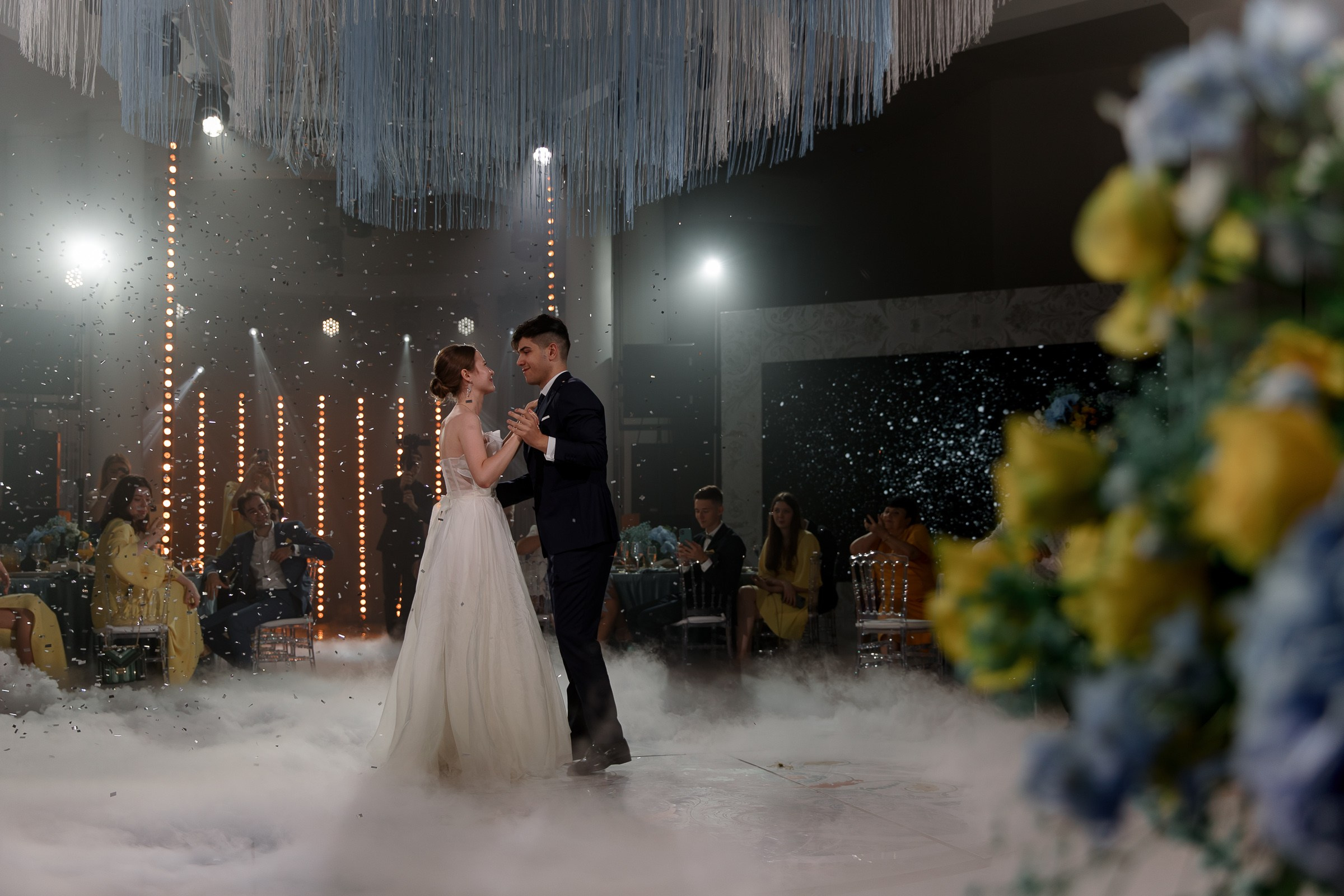 Bride and groom embrace on dancefloor, by Bude, Cornwall wedding photographer.