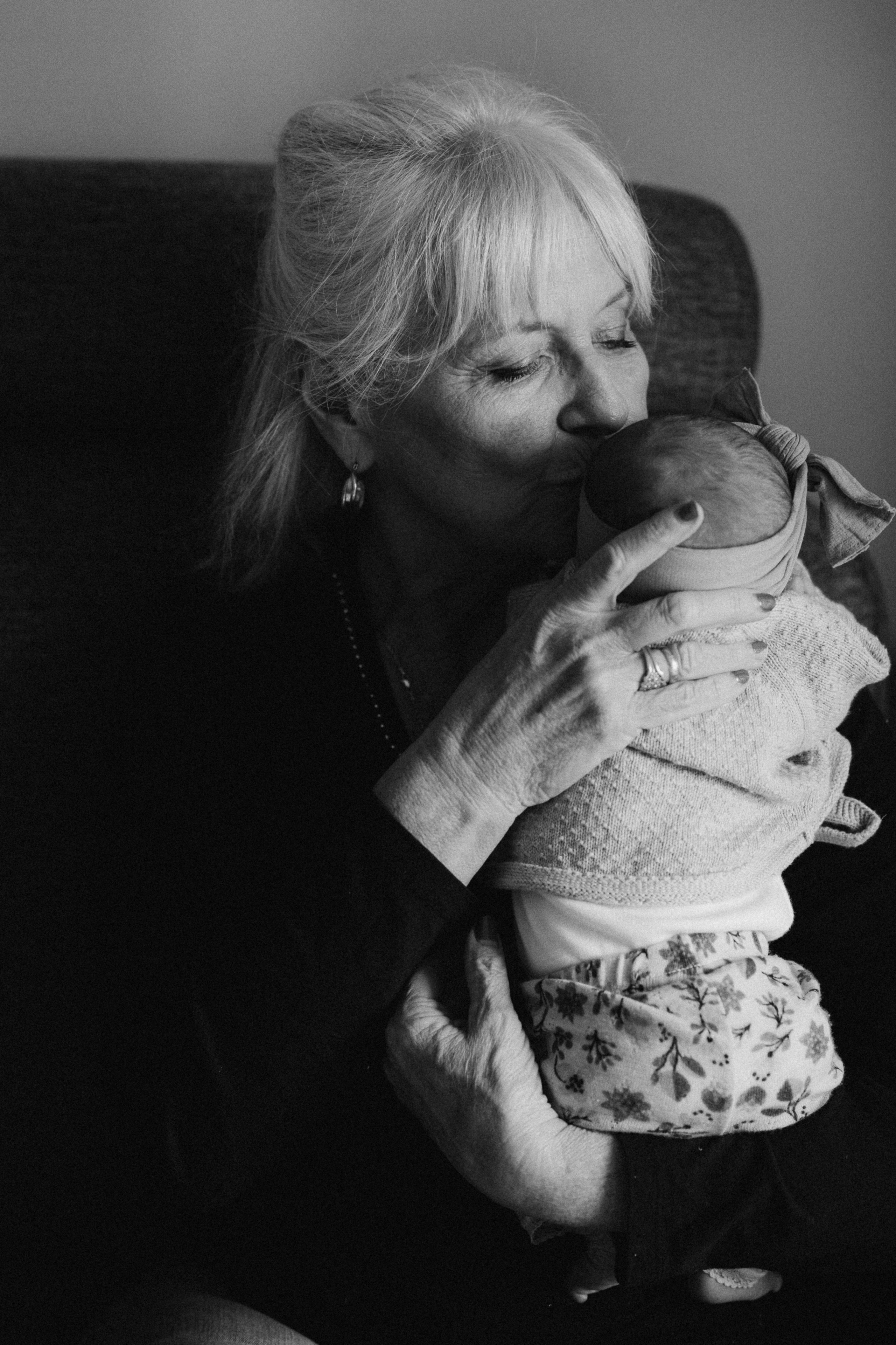 grandma kissing the baby
