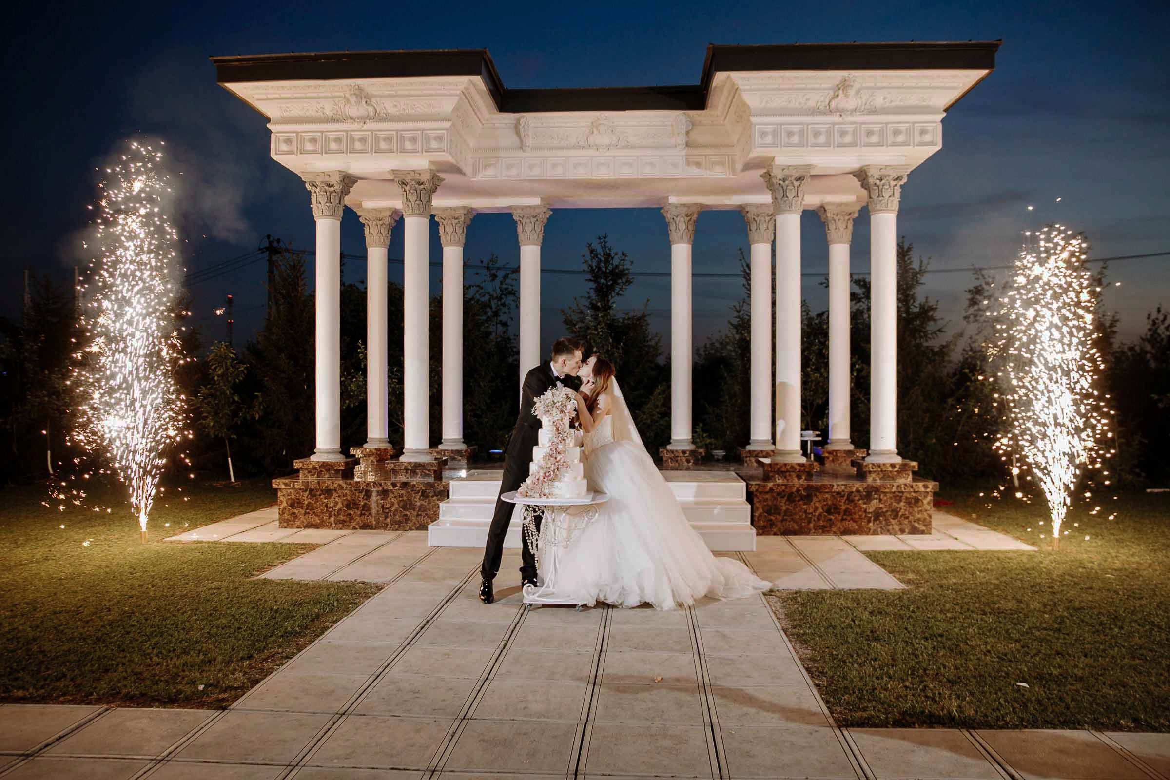 Couple’s cake cutting with fireworks, by Tanya Bodgan, Bude wedding photography.