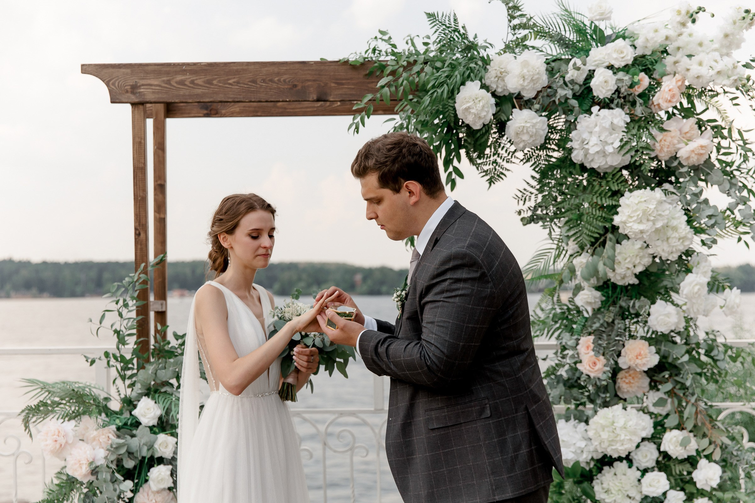  Ring exchange during ceremony, by Bude, Cornwall wedding photographer.
