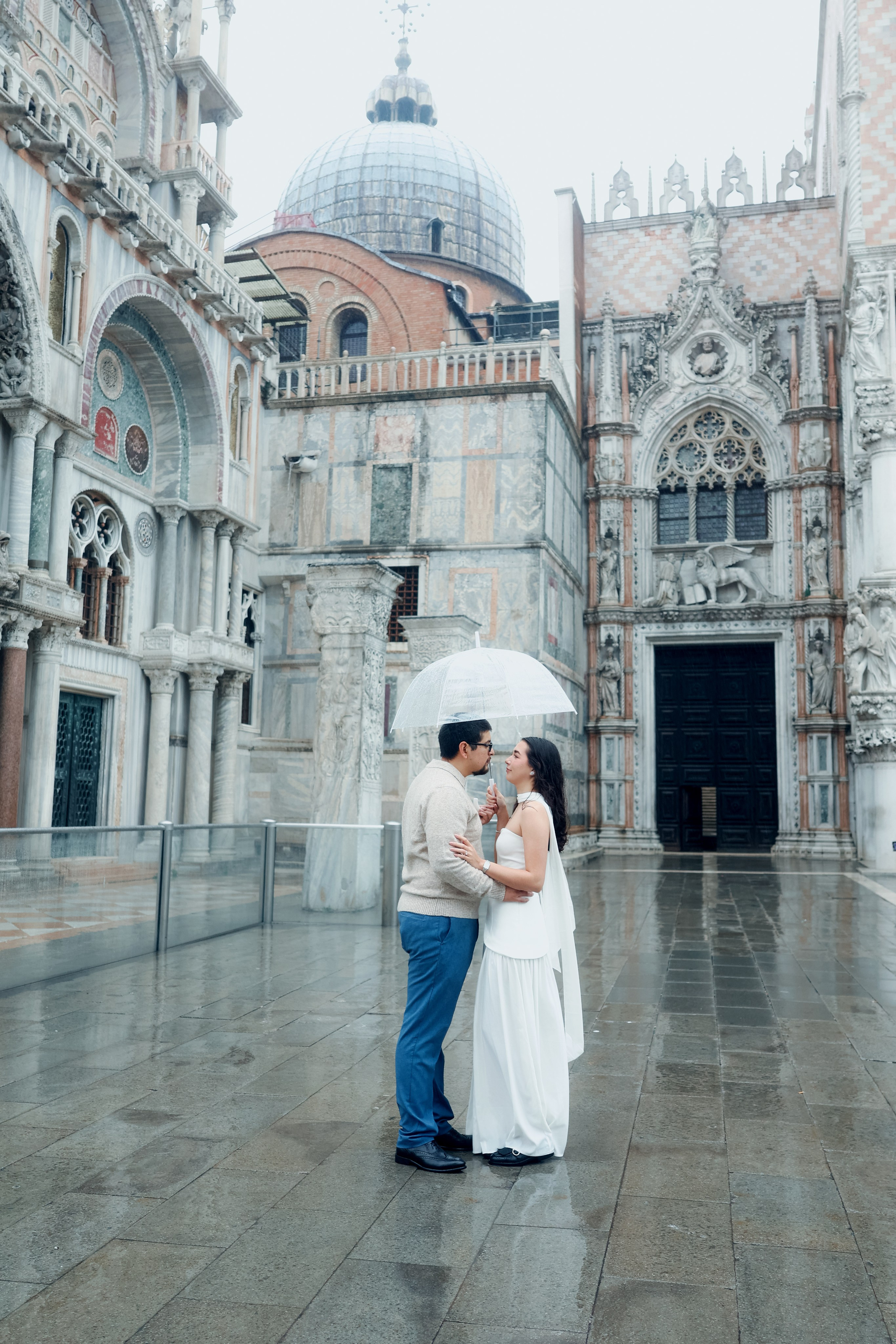 Venice couple portrait in the rain, featuring umbrella, canals