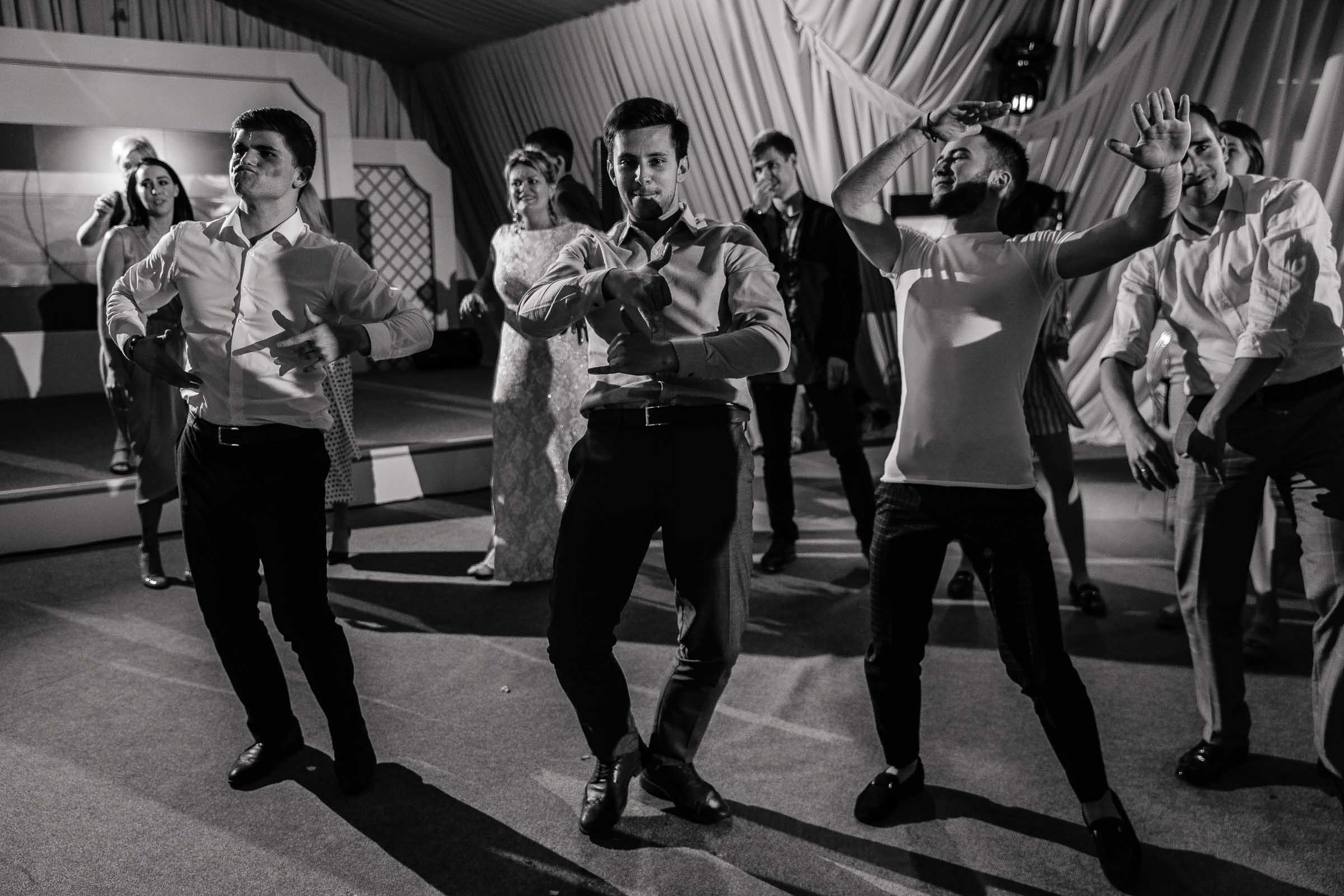 Groomsmen dancing, by Tanya Bodgan, Bude, Cornwall wedding photography.