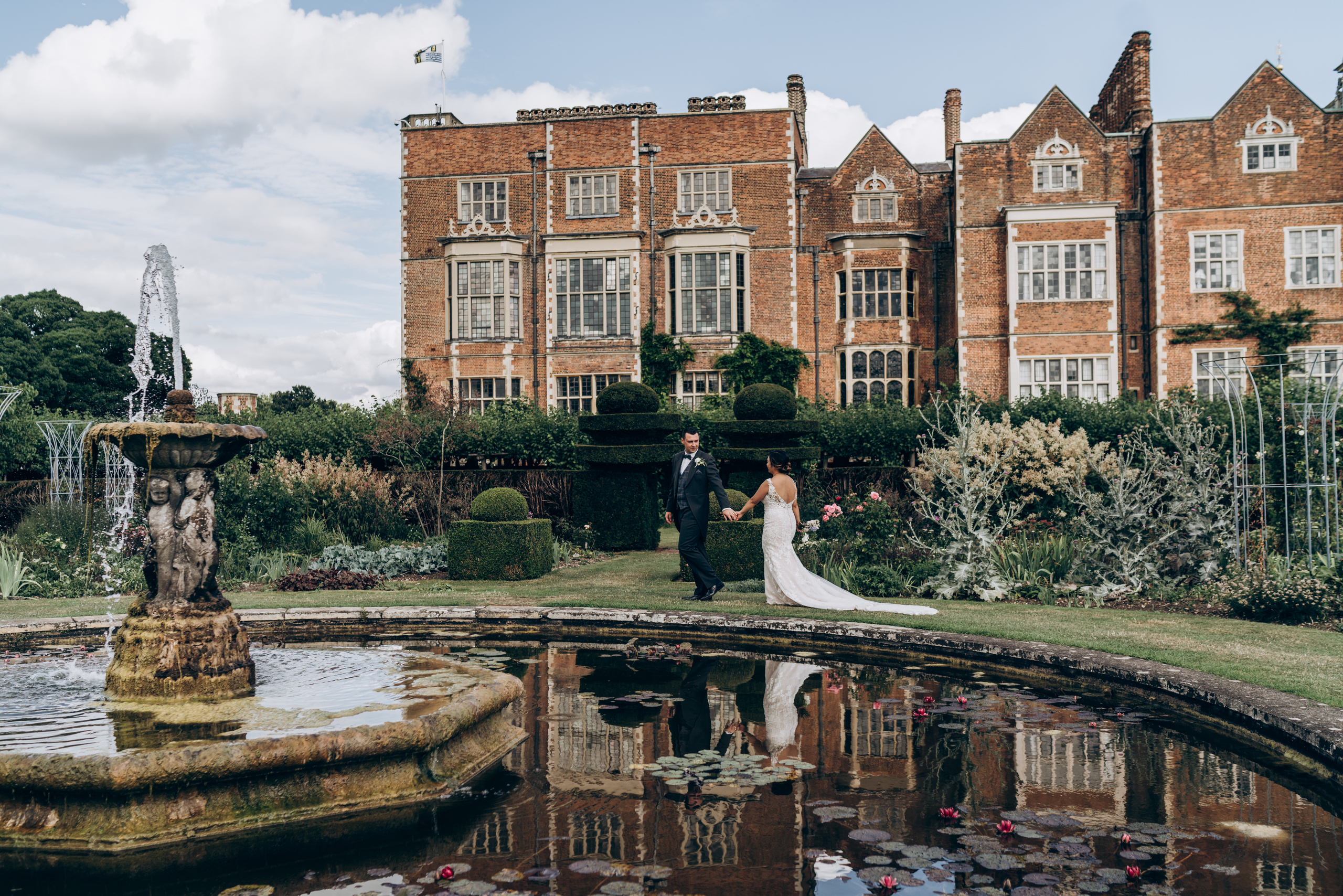 bride and groom are arriving to luxury wedding venue for reception 