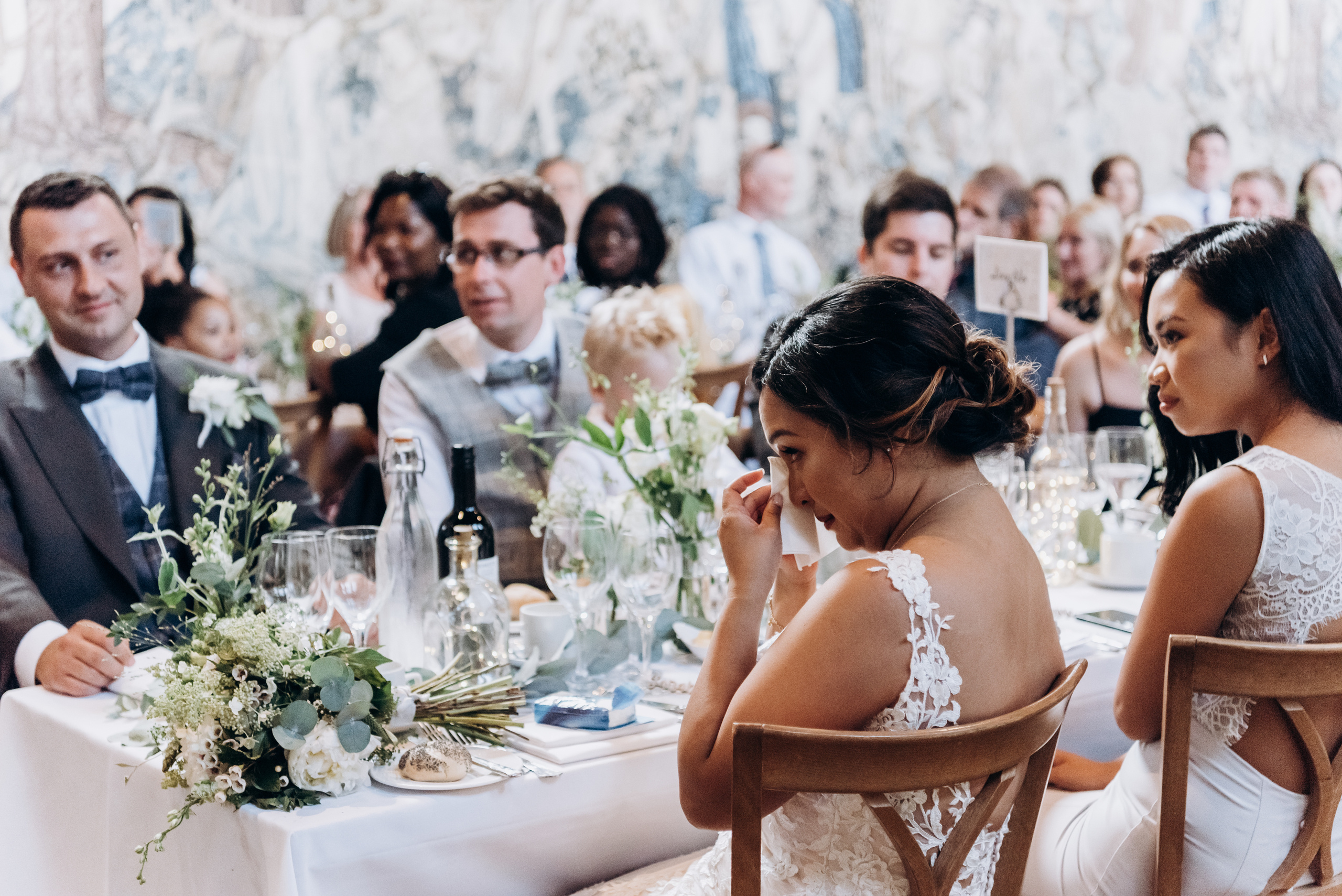 bride is crying siting by the table 