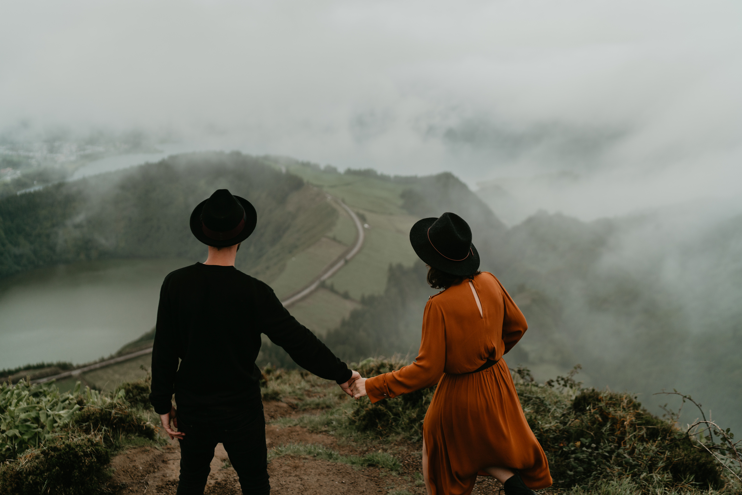 couple walking on the top of the mountain 