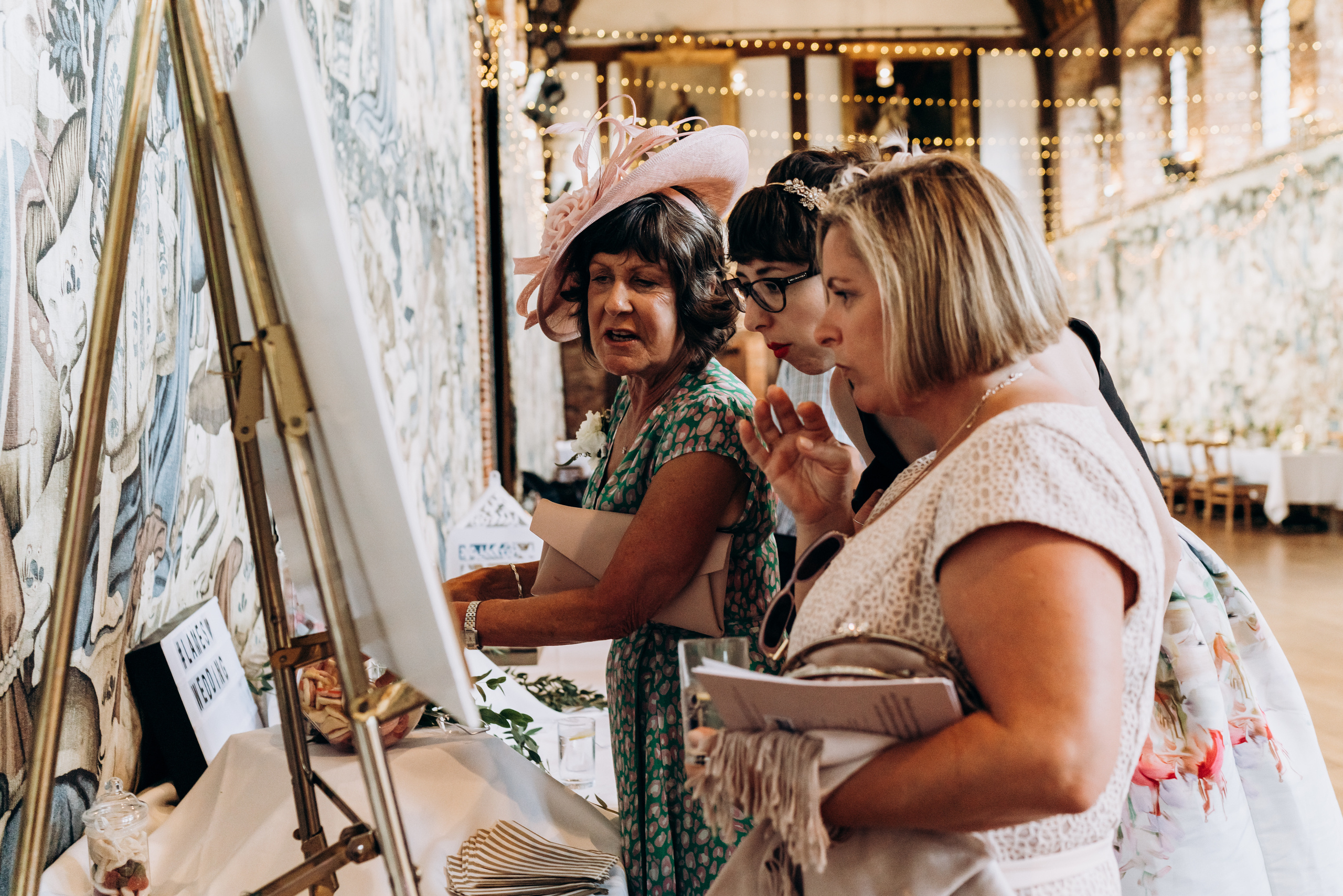 wedding guests are checking table plan before the banquet 