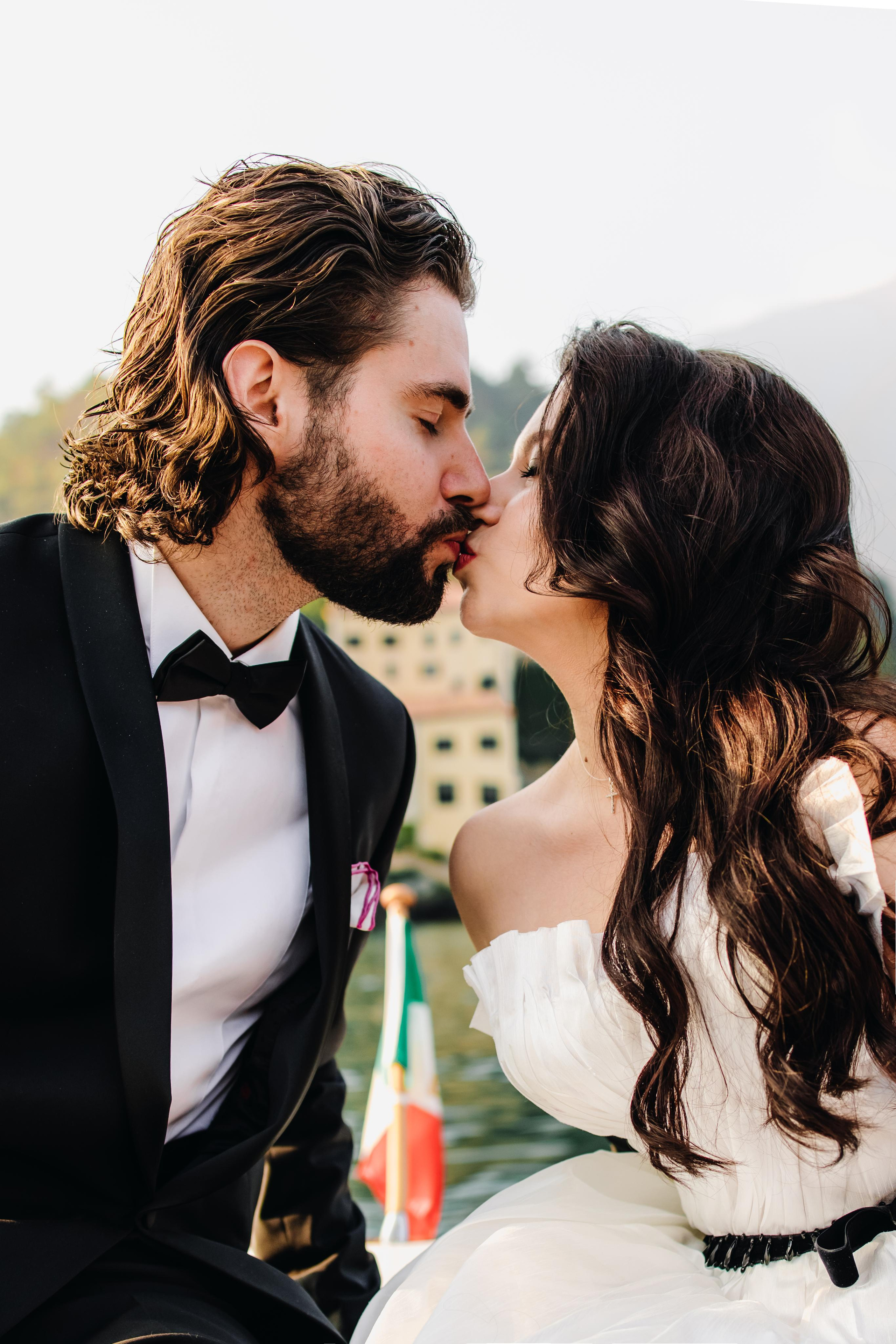 The kiss of bride and groom on the boat