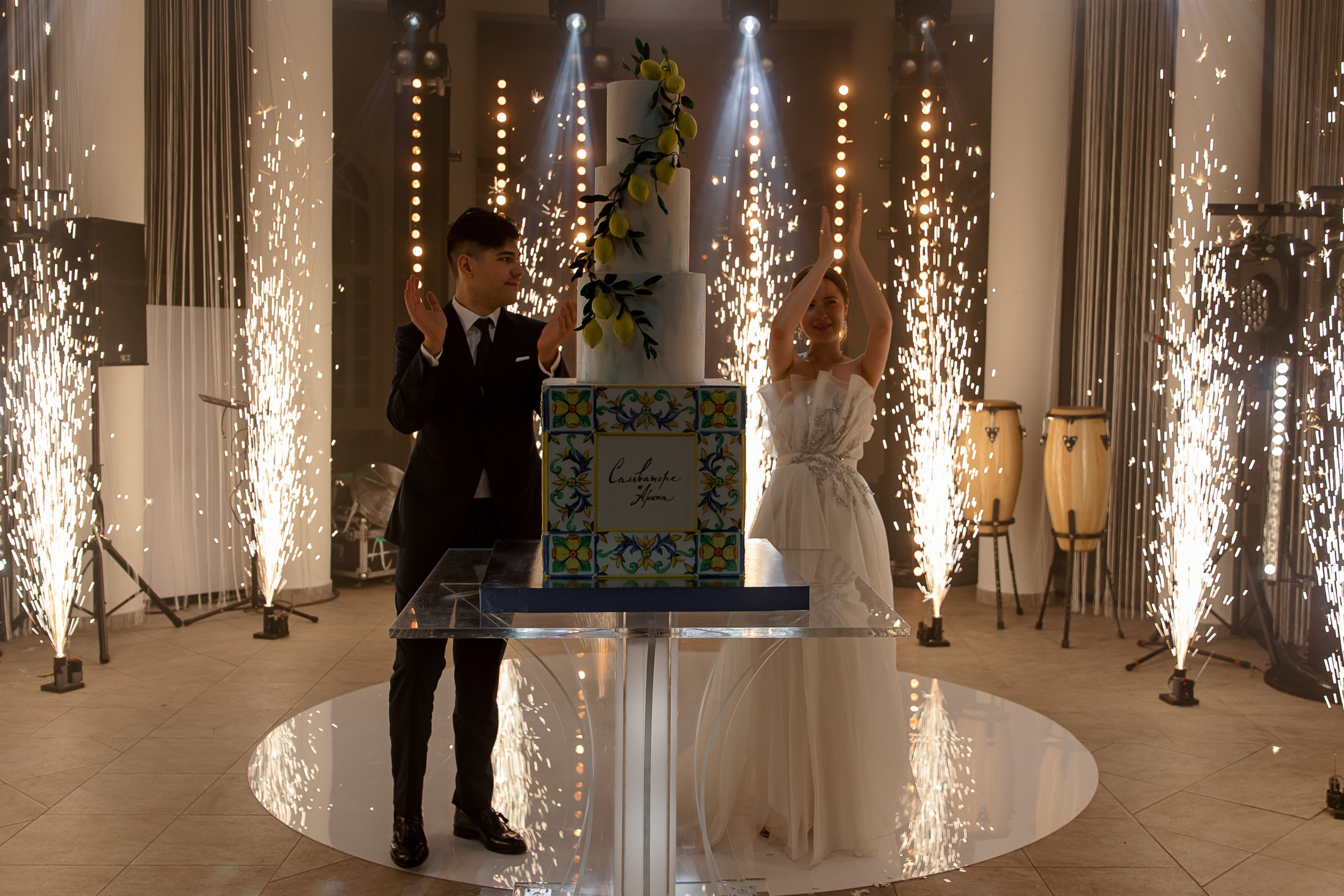Sparkler-lit cake, by Cornwall wedding photographer.
