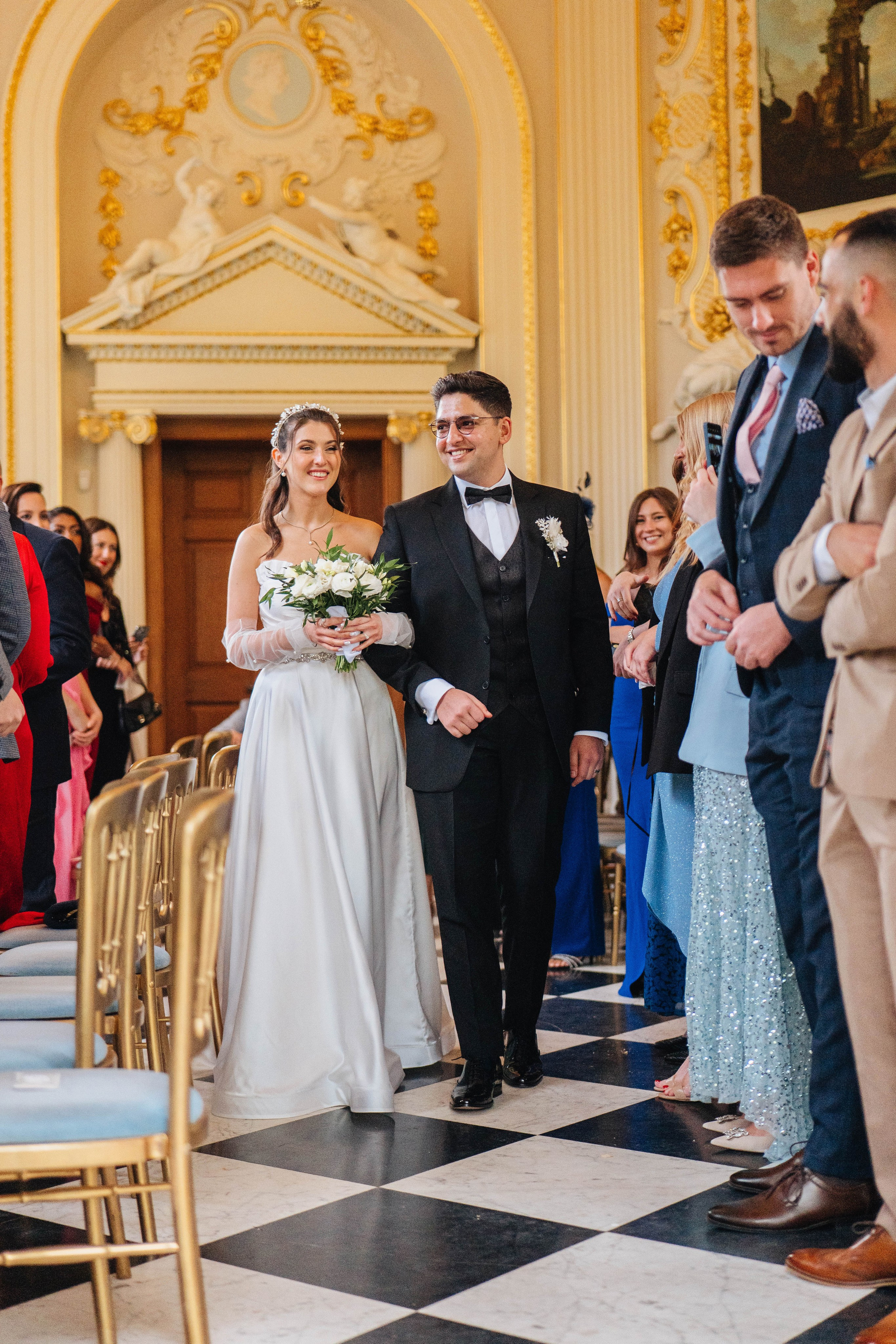 photo of the wedding ceremony, close up of bride and groom leaving the venue