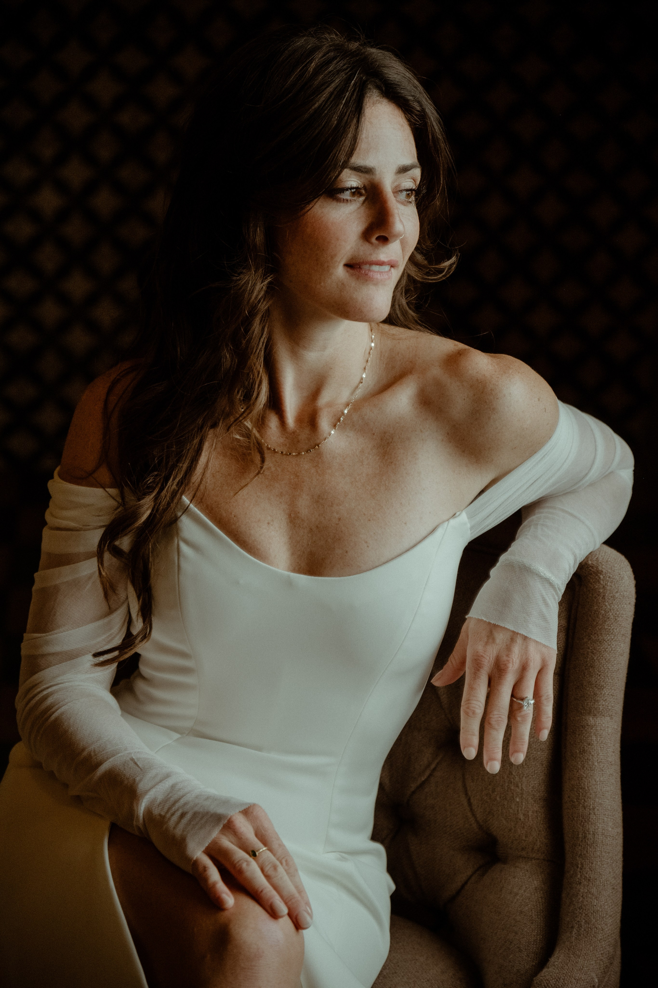 A bride sitting in a gorgeous wedding dress