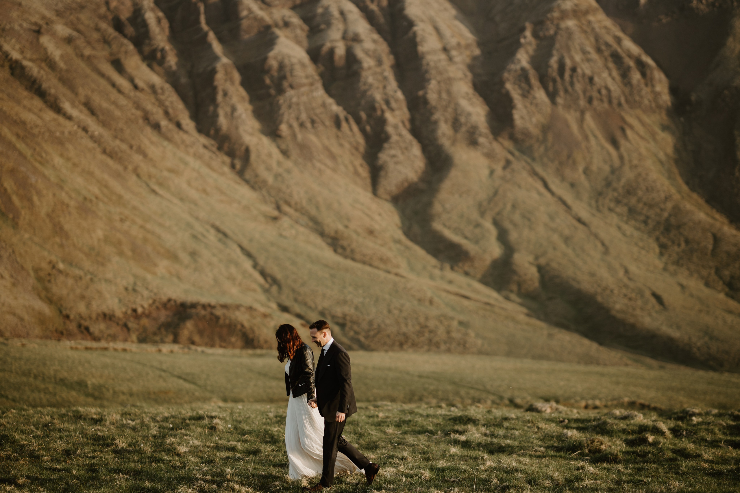 Candid couple’s moment in Iceland’s untamed wilderness, where love meets adventure
