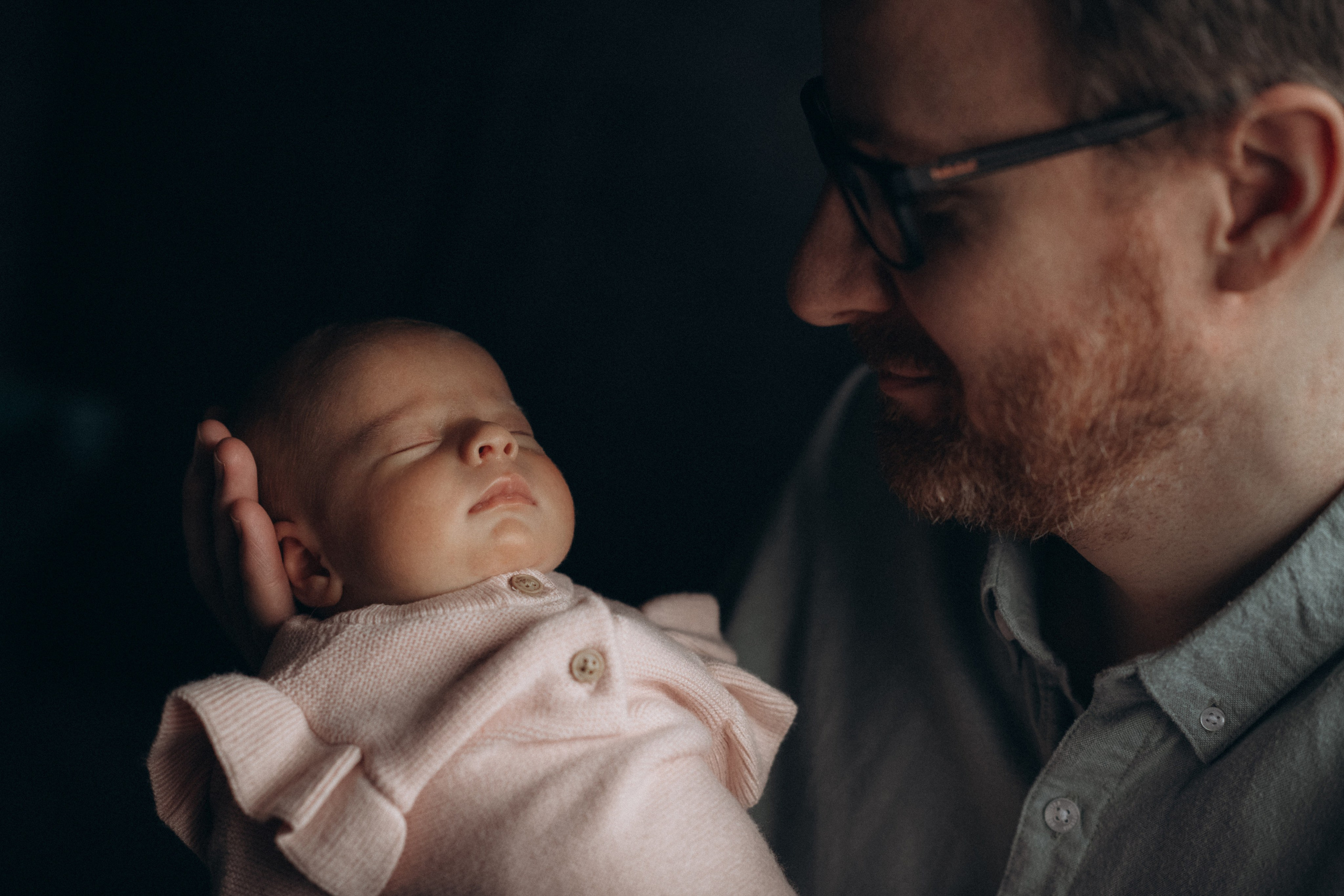 father holds his baby