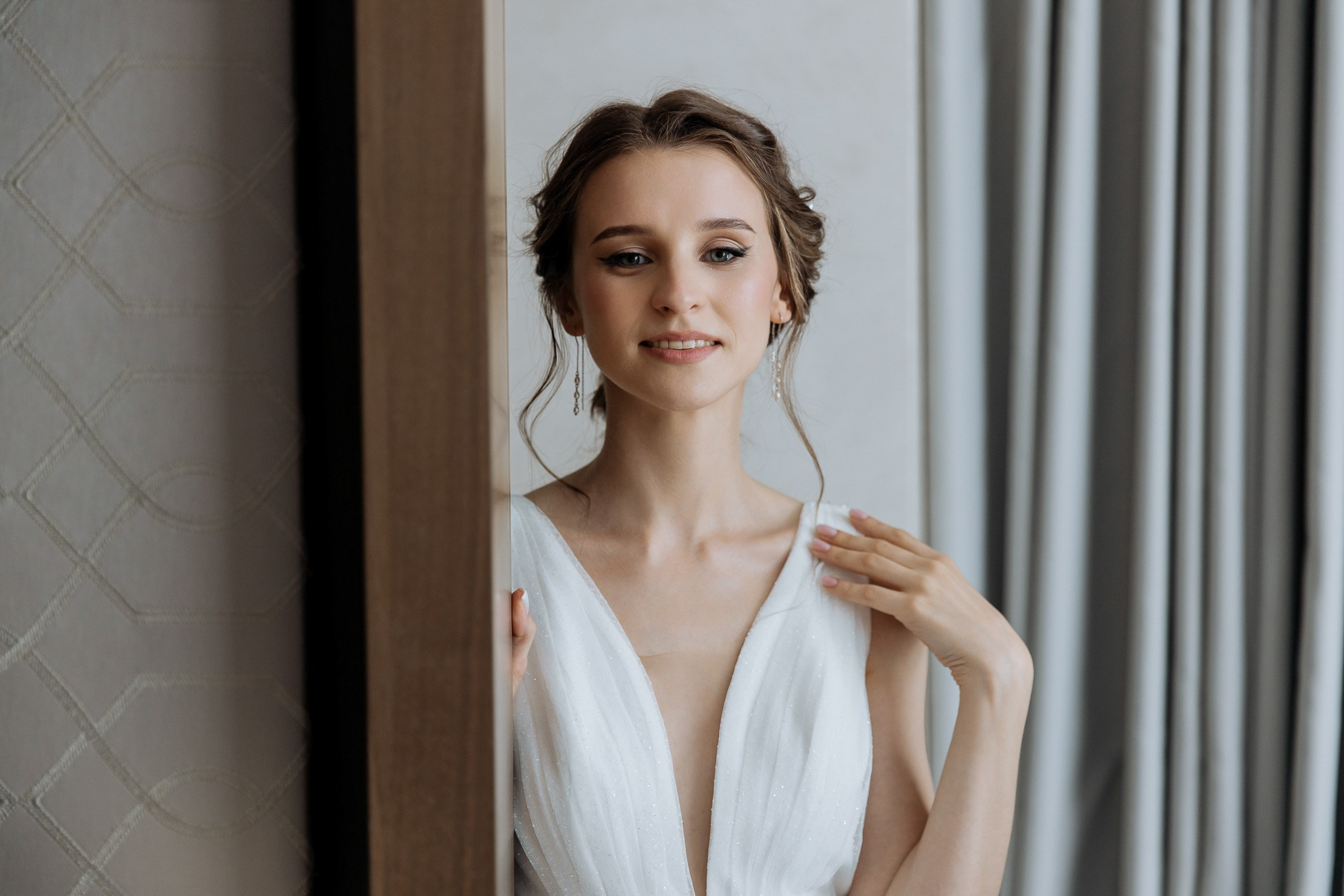 Bride’s morning smile, by Cornwall editorial wedding photographer.