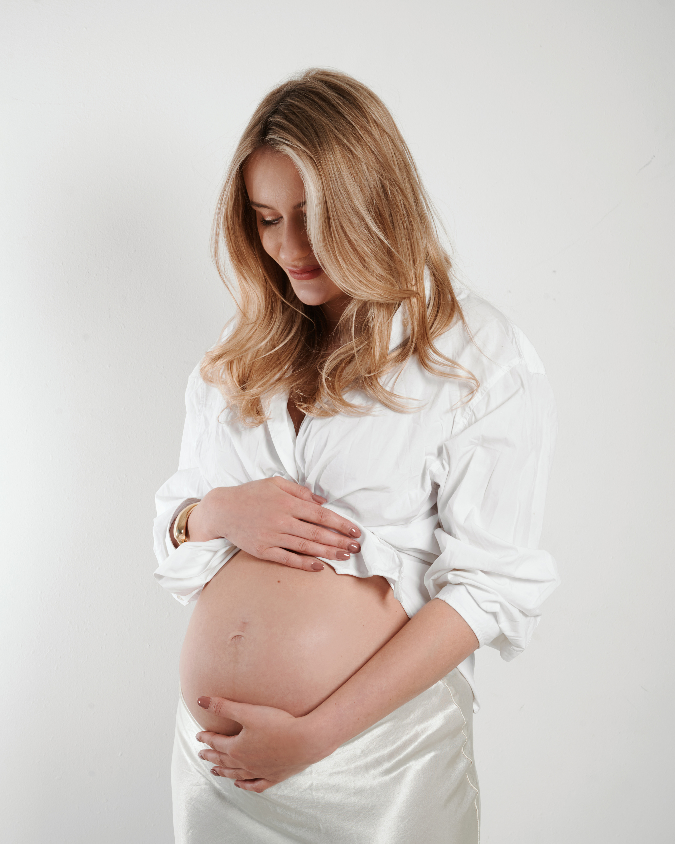 Elegant and sophisticated poses showcasing the beauty of pregnancy in a West Yorkshire studio photoshoot.