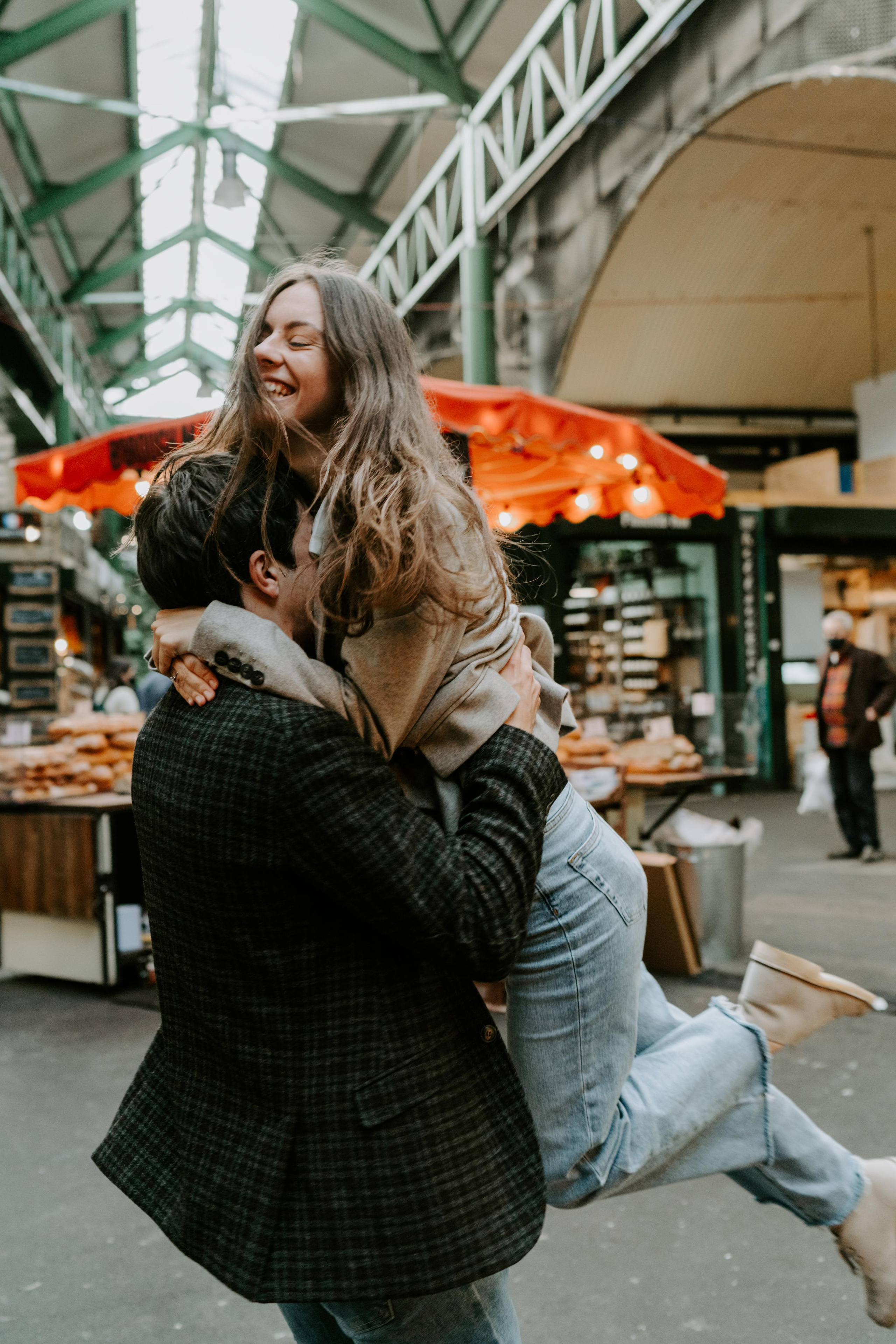young man lifting his fiancé 