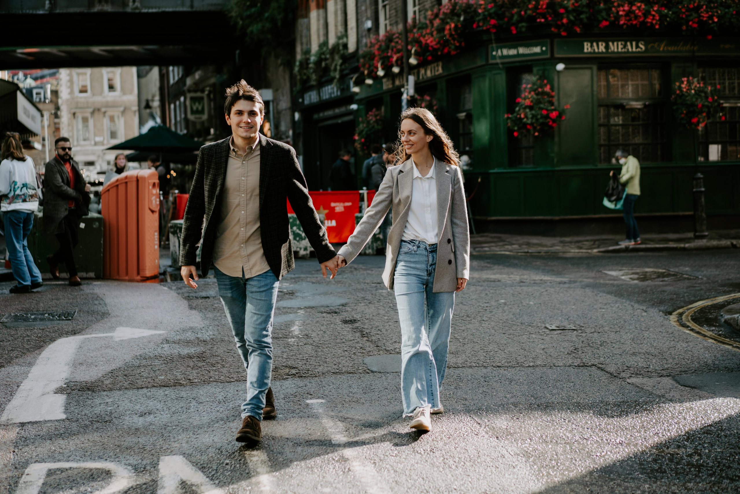 young couple walking through the market 