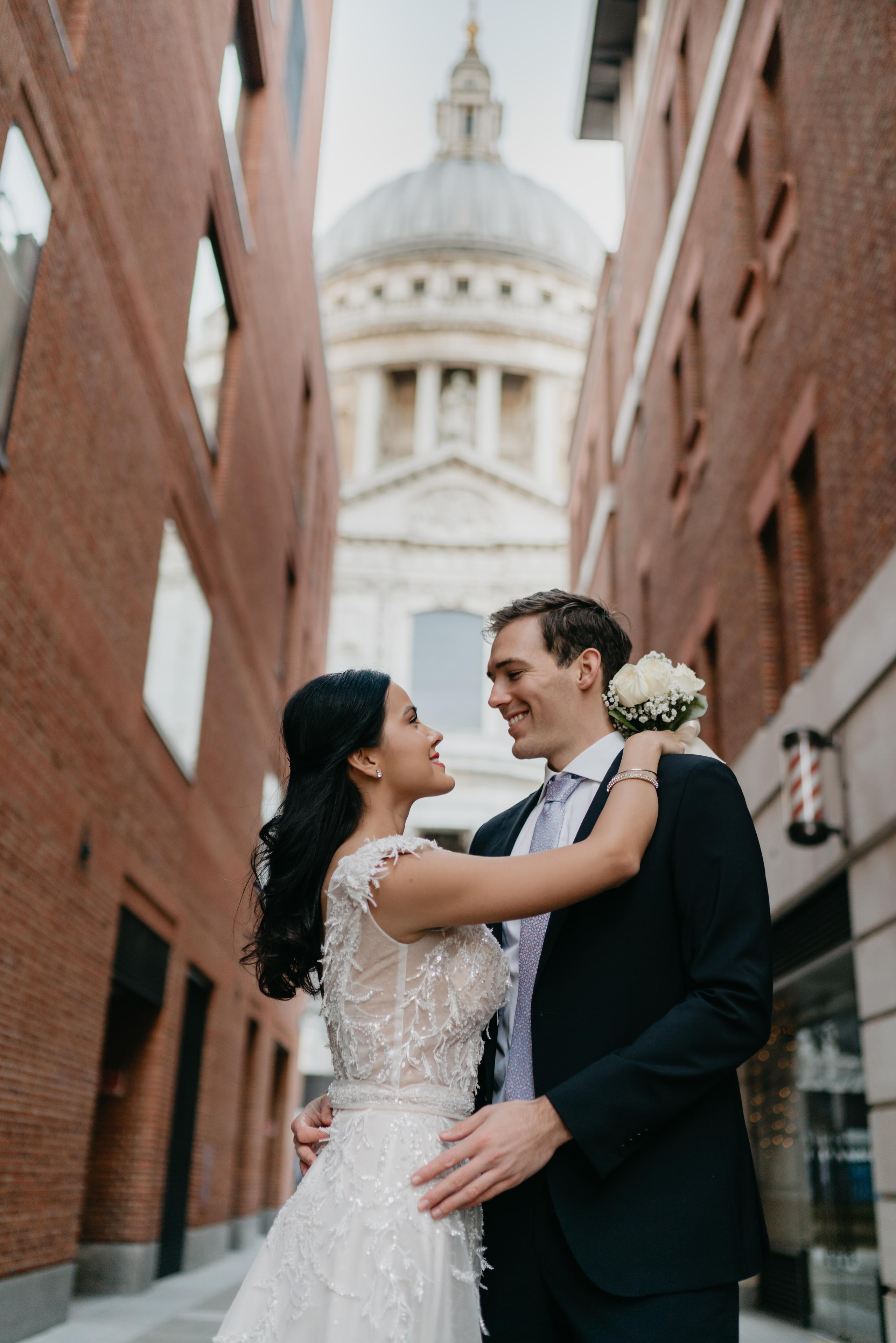 Wedding session by Tower Bridge and St Pauls Cathedral. London portrait and family photographer