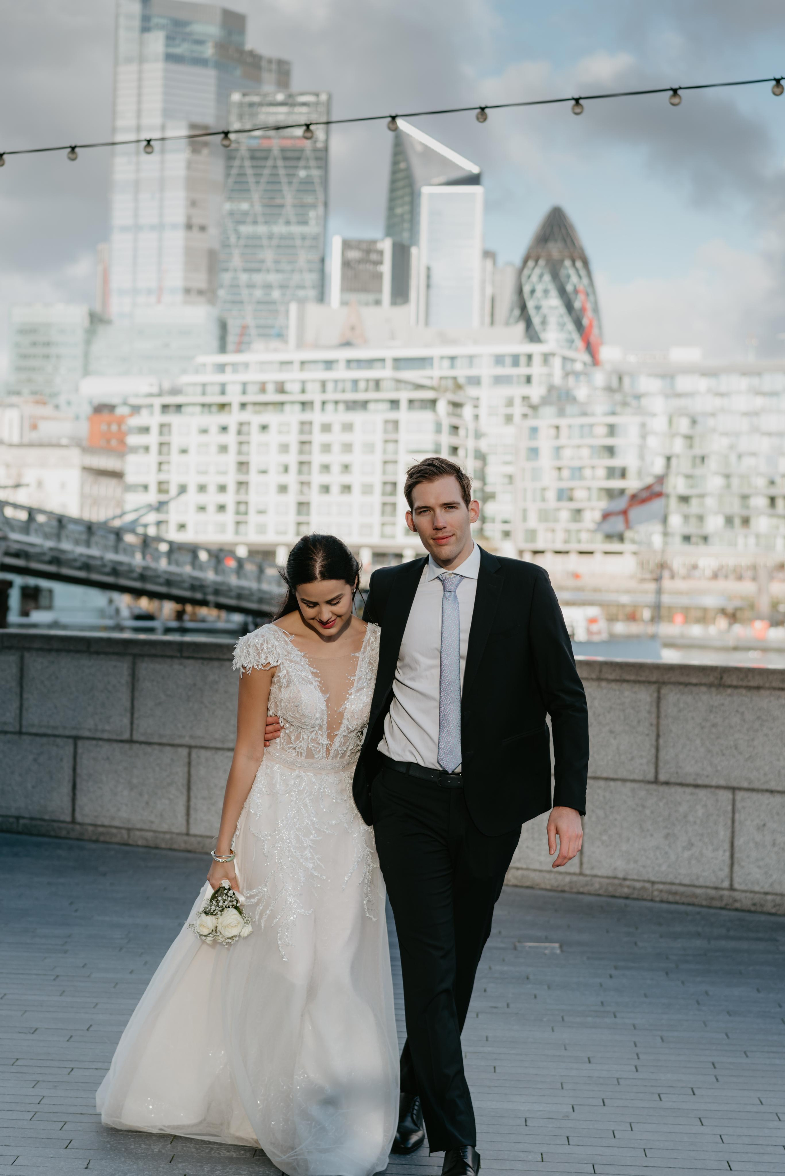 Wedding session by Tower Bridge and St Pauls Cathedral. London portrait and family photographer