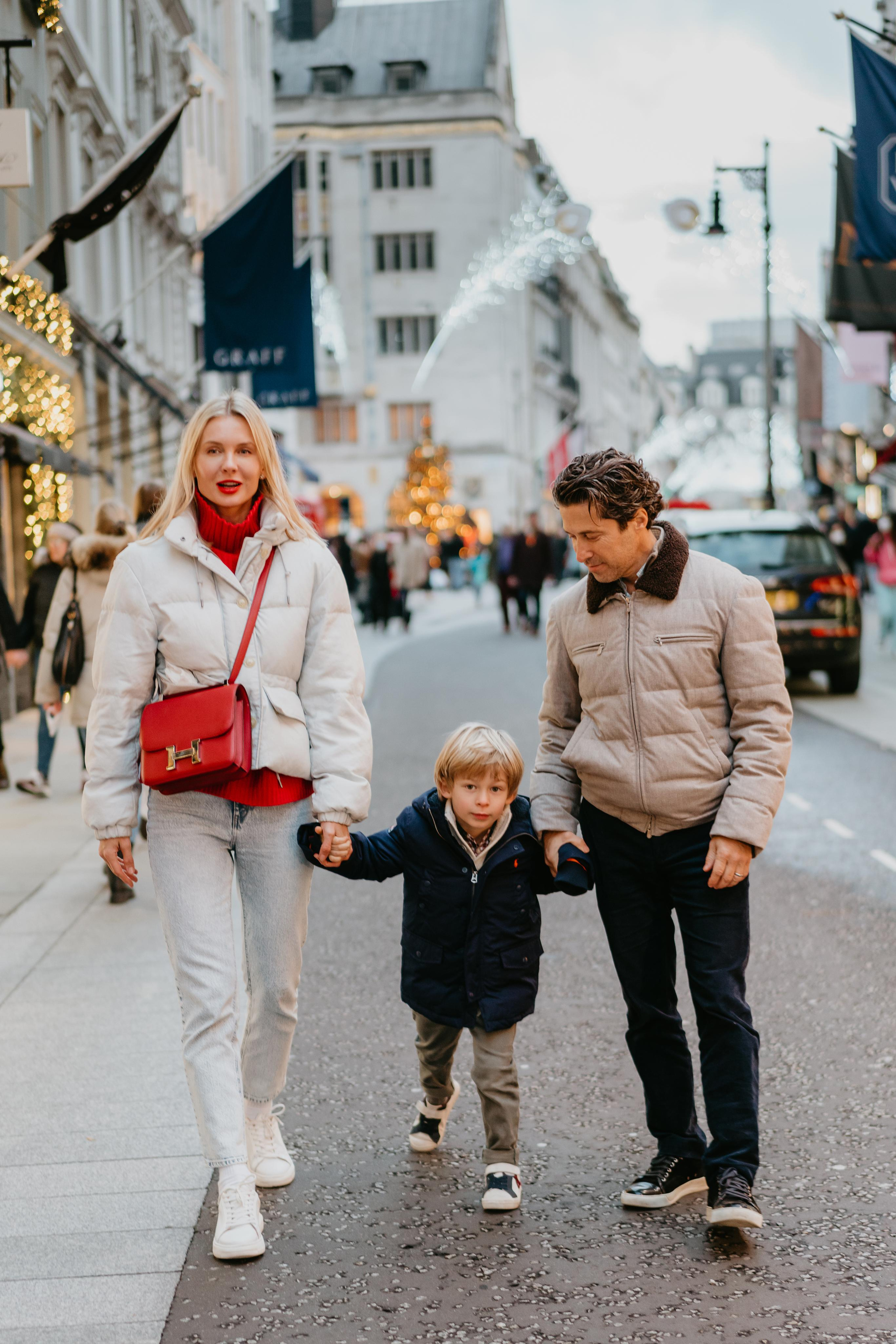 family walking posing on the street 