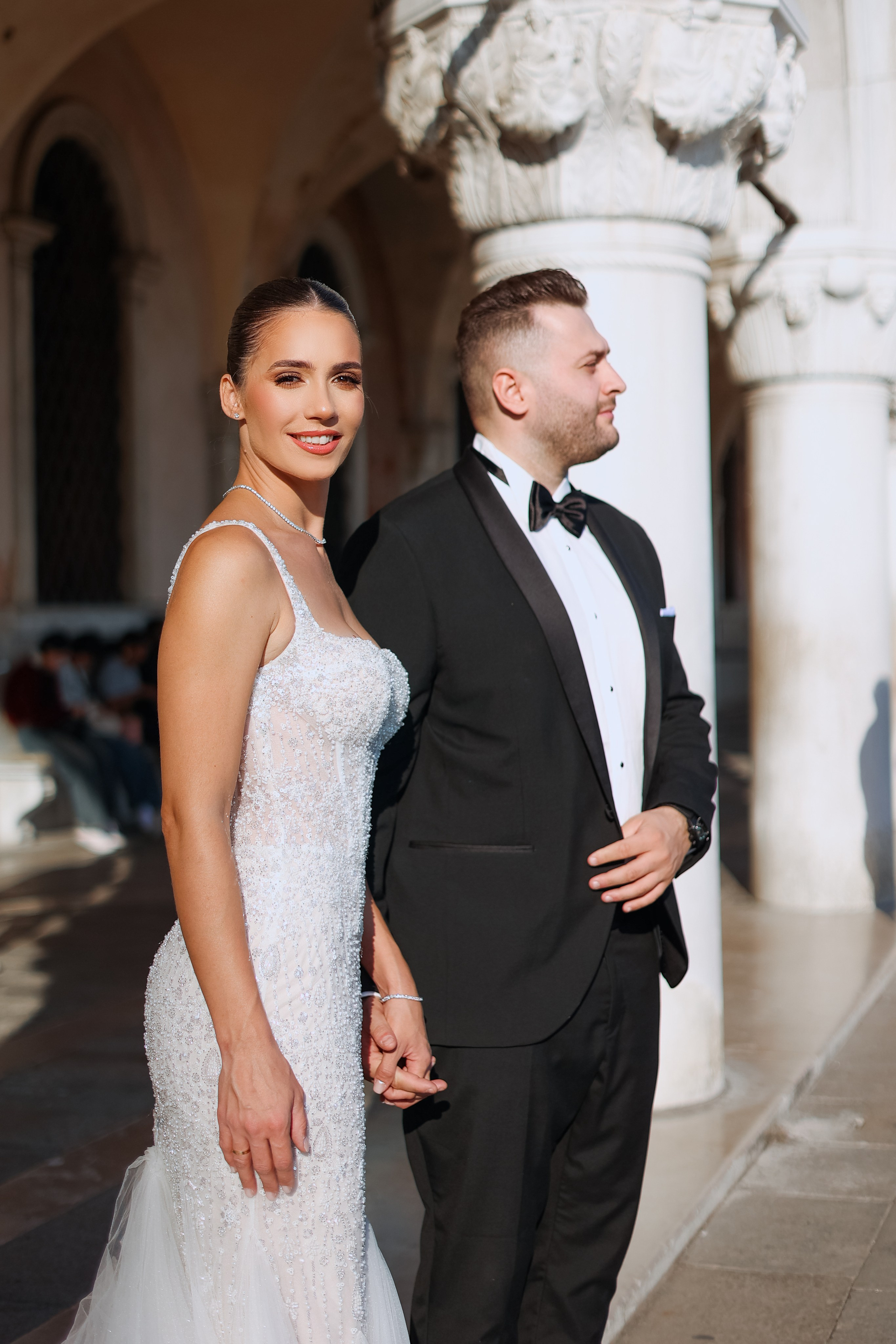 Bride and groom walking in Venice 