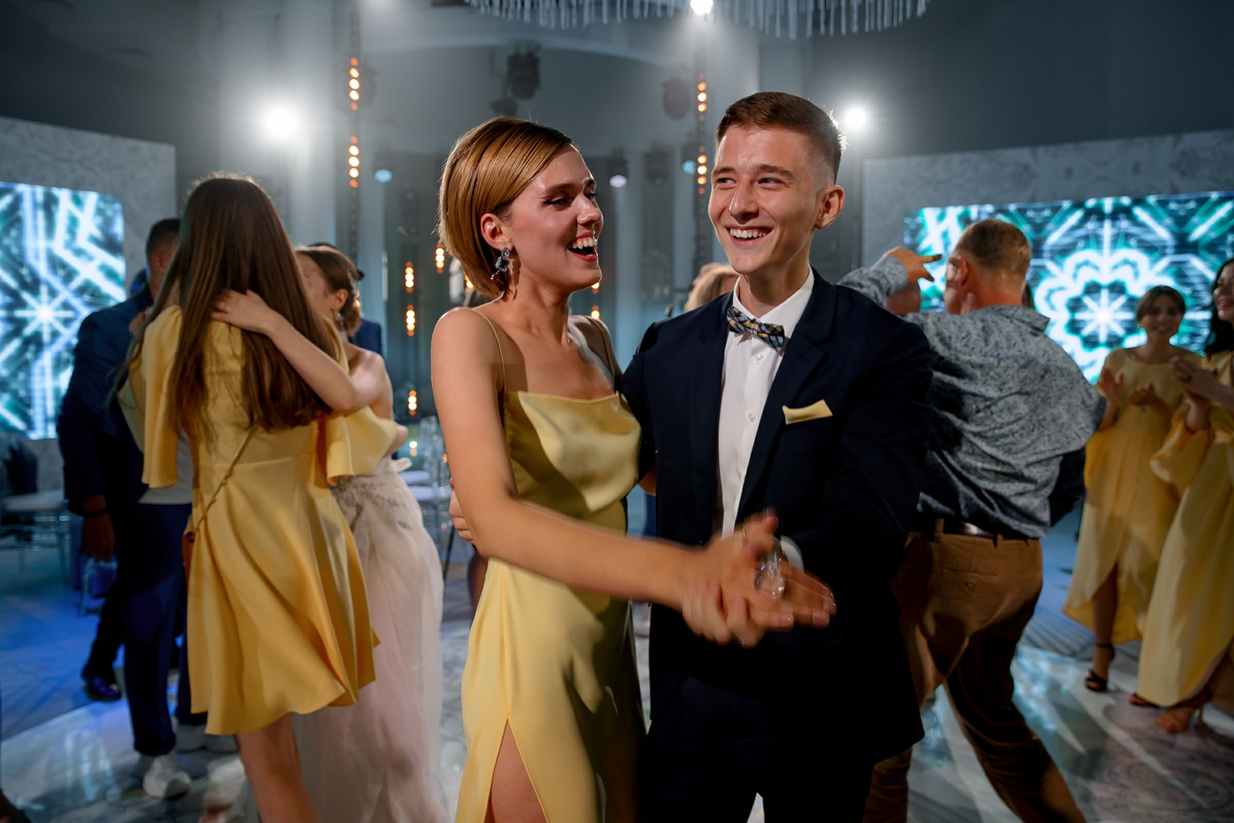 Guests dancing at night, by Cornwall reportage photographer.