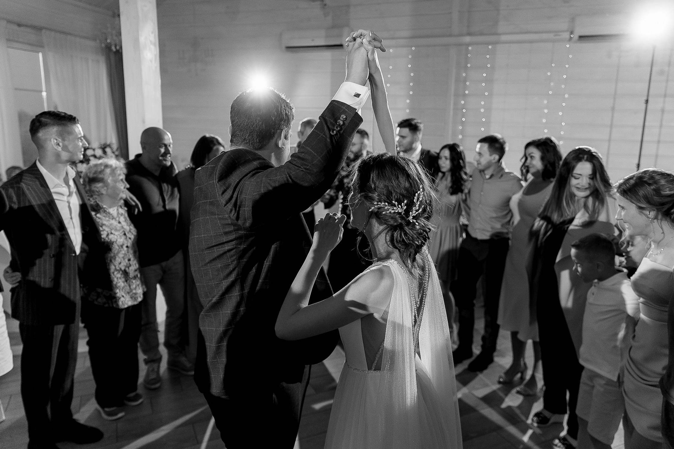 Couple’s lively dance floor moment, by Cornwall reportage photographer.