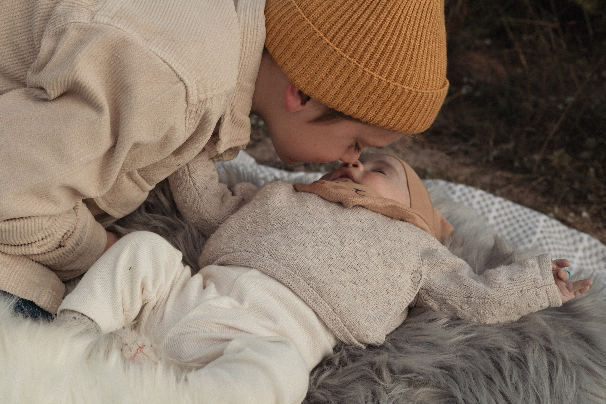 Sibling love, big brother kissing the small one. Siblings photoshoot