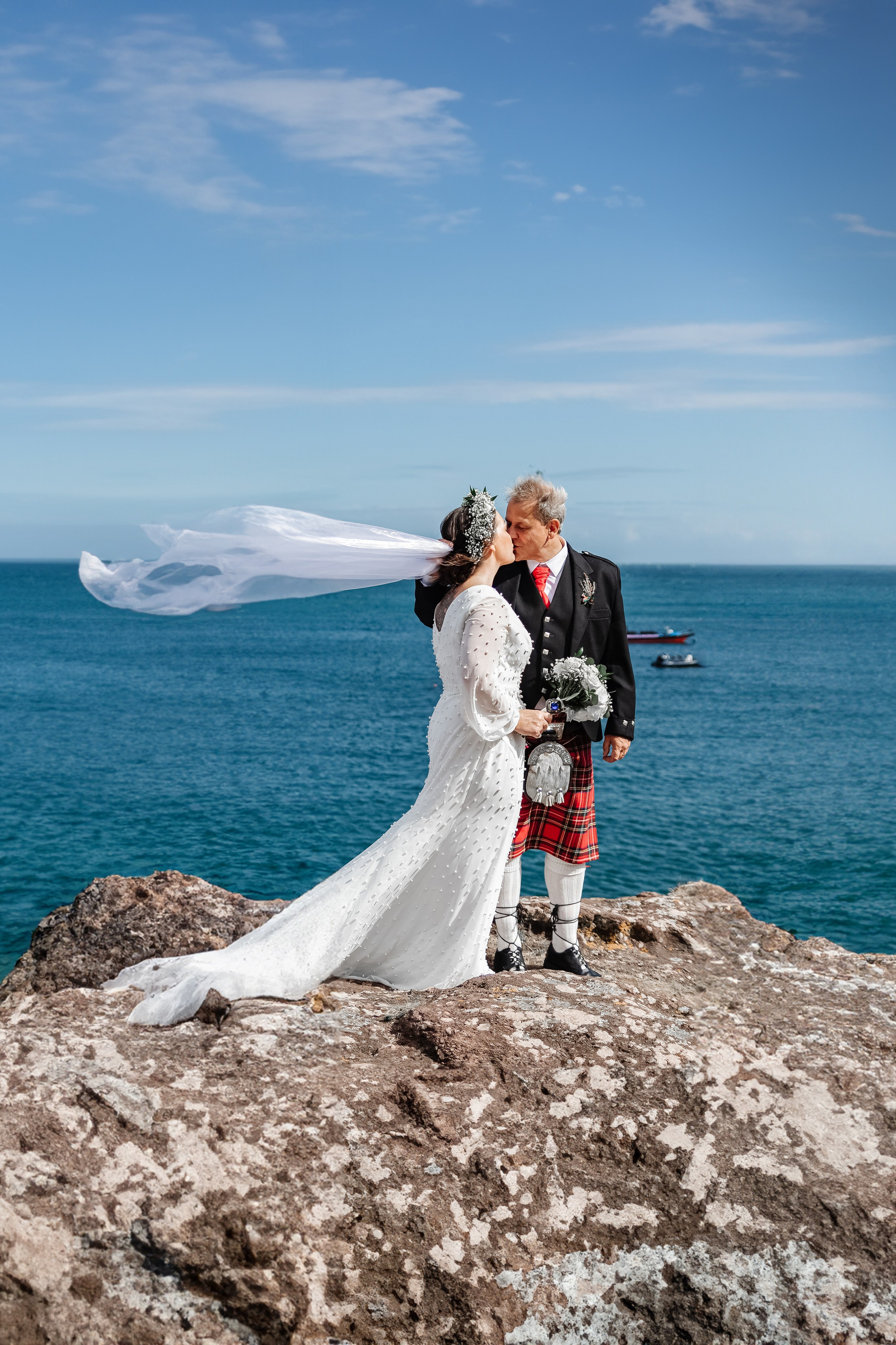 Bride and groom kiss at Dunmore East wedding