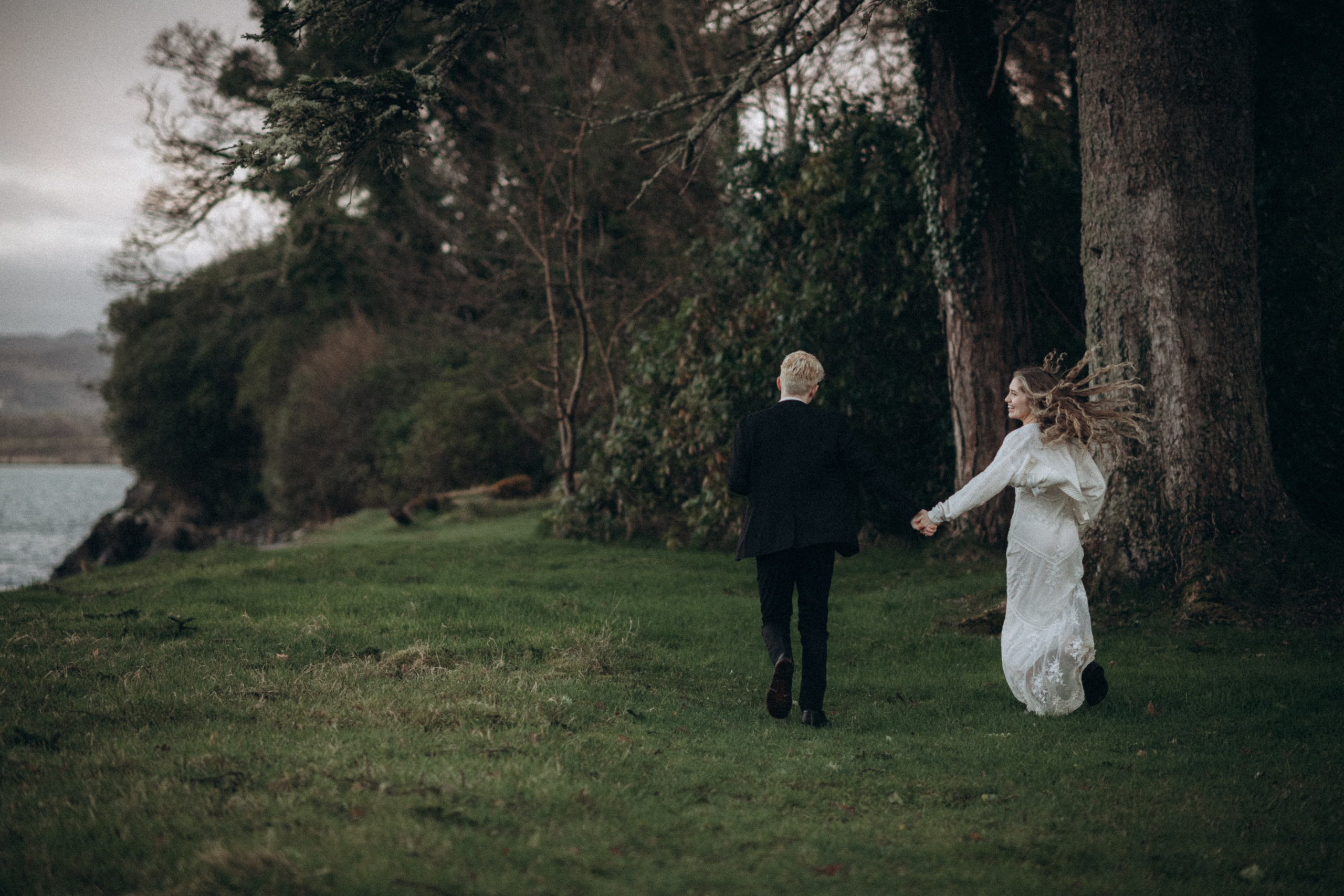 portrait of running couple by the lake