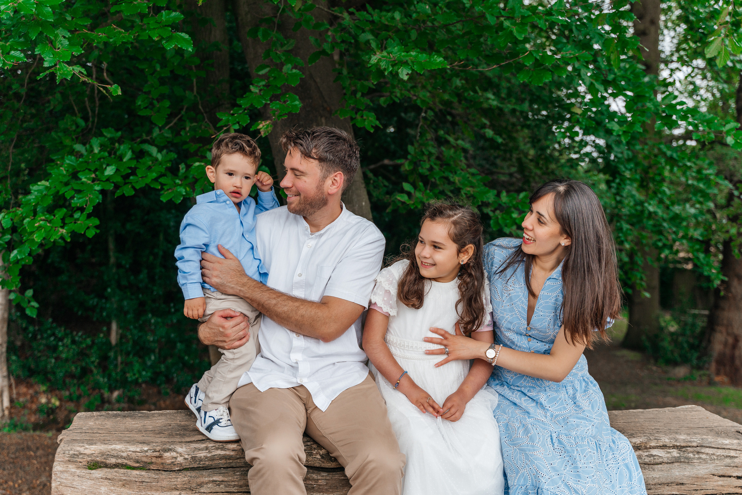 A family photo shoot in black park.